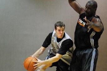 PHOENIX - OCTOBER 7: Goran Dragic #2 passes around Shaquille O'Neal #32 of the Phoenix Suns during NBA TV's Real Training Camp visit to the Phoenix Suns on October 7, 2008, at U.S. Airways Center in Phoenix, Arizona. NOTE TO USER: User expressly acknowled