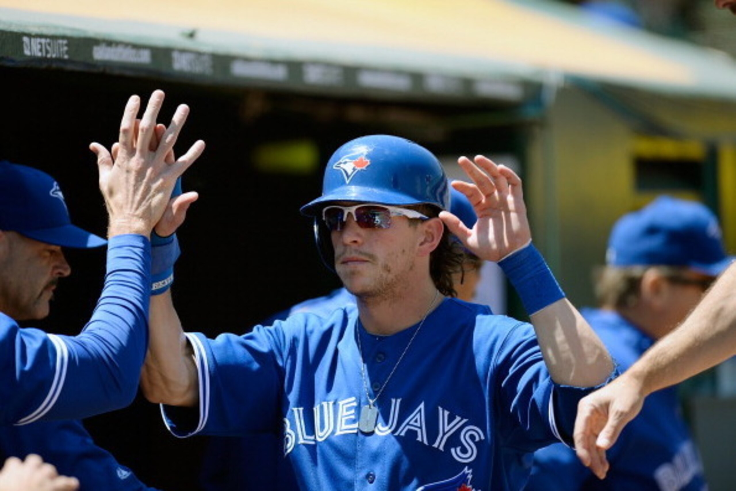 OAKLAND, CA - JULY 31:  Colby Rasmus #28 of the Toronto Blue Jays is congratulated by teammates after he scored on a passed ball in the fourth inning against the Oakland Athletics at O.co Coliseum on July 31, 2013 in Oakland, California.  (Photo by Thearo