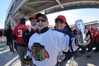 WASHINGTON, DC - JANUARY 01:  A Chicago Blackhawks cheers on during the 2015 Bridgestone NHL Winter Classic at Nationals Park on January 1, 2015 in Washington, D.C.  (Photo by Eliot J. Schechter/NHLI via Getty Images)