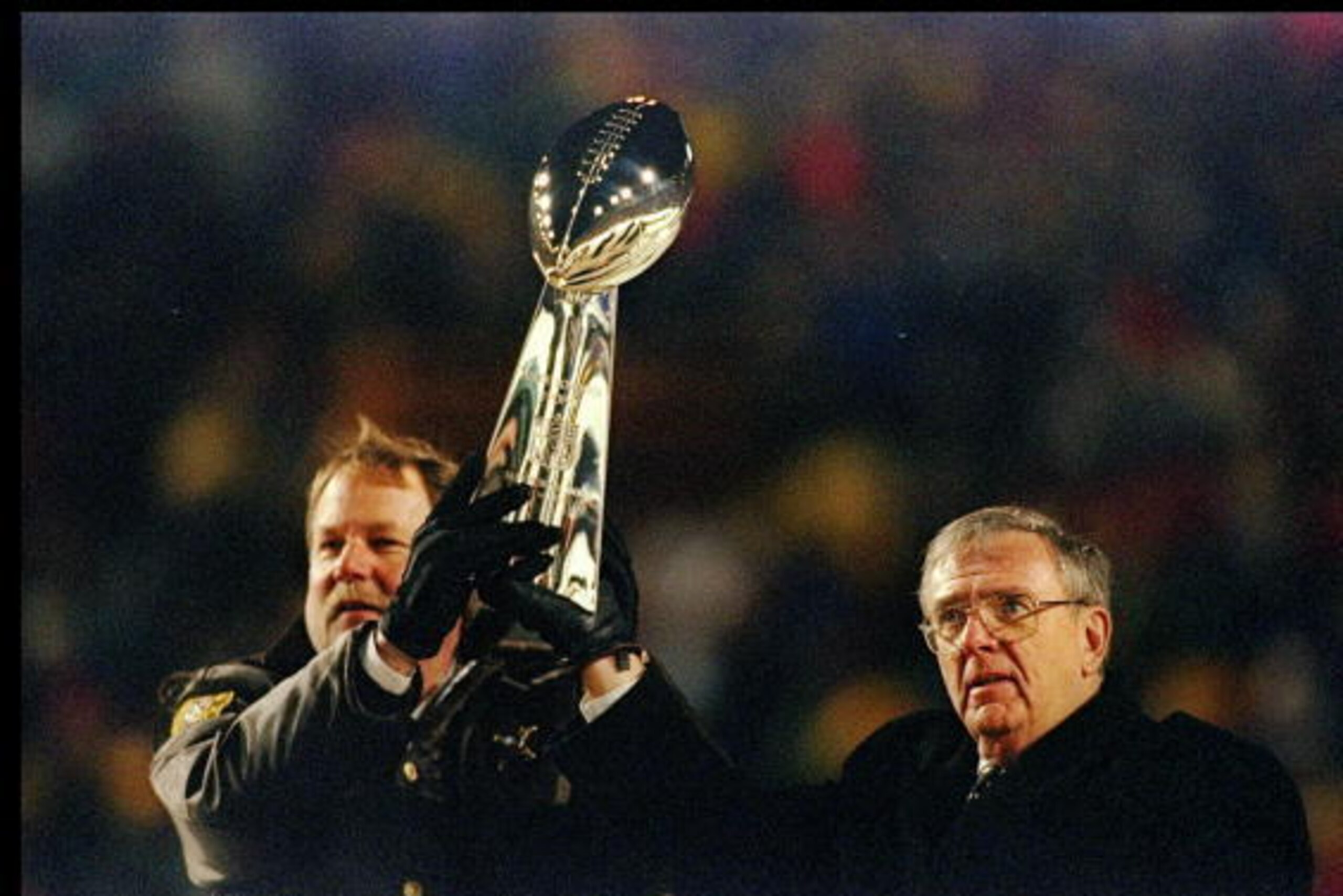 27 Jan 1997: Green Bay Packers head coach Mike Holmgren and Ron Wolf celebrate with the Vince Lombardi Trophy during a post-Super Bowl celebration at Lambeau Field in Green Bay, Wisconsin.