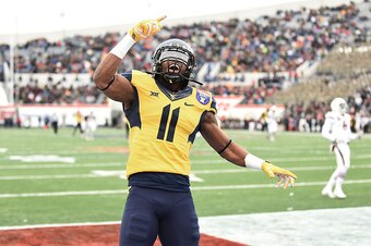 MEMPHIS, TN - DECEMBER 29:  Kevin White #11 of the West Virginia Mountaineers reacts to a touchdown against the Texas A&M Aggies during the second quarterof the 56th annual Autozone Liberty Bowl at Liberty Bowl Memorial Stadium on December 29, 2014 in Mem