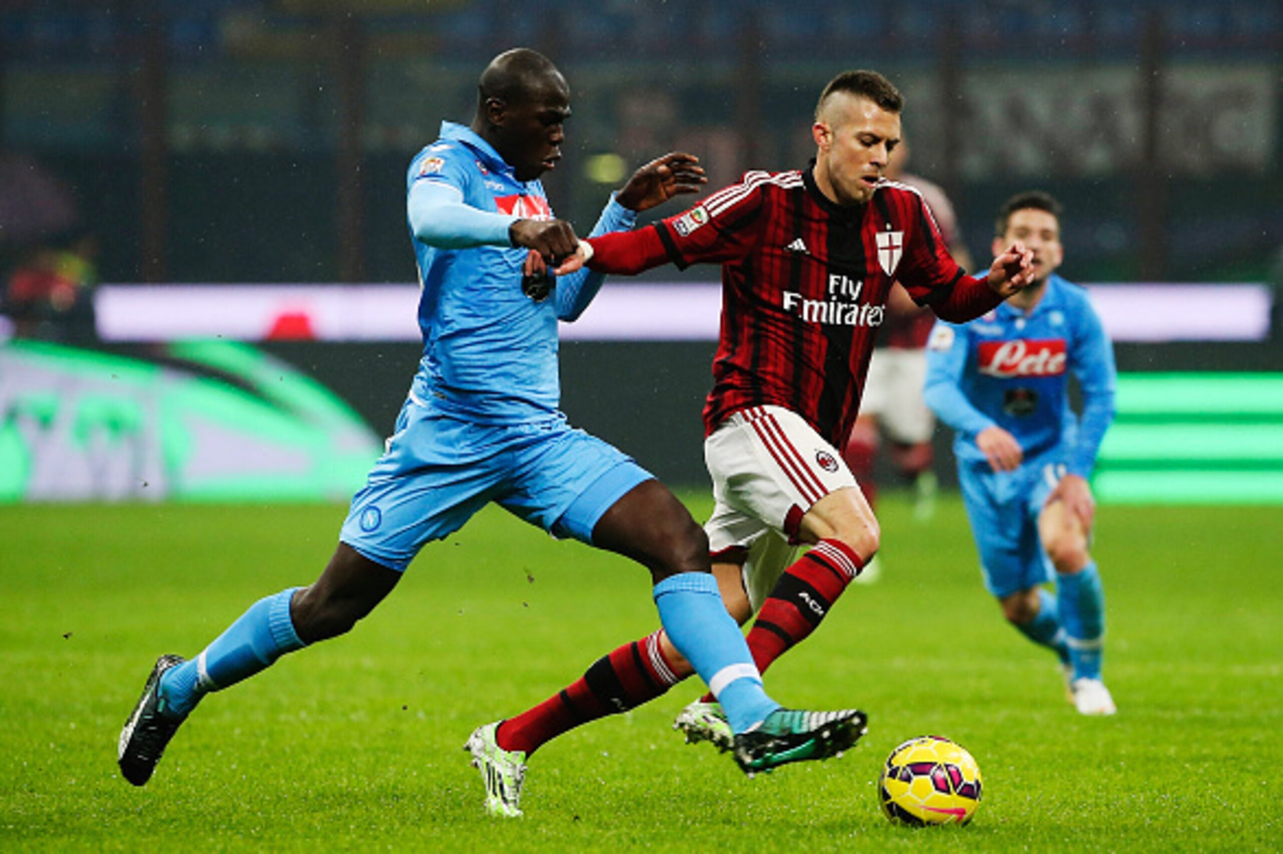 MILAN, ITALY - DECEMBER 14:  Jeremy Menez (R) of AC Milan cis challenged by Kalidou Koulibaly (L) of SSC Napoli during the Serie A match between AC Milan and SSC Napoli at Stadio Giuseppe Meazza on December 14, 2014 in Milan, Italy.  (Photo by Marco Luzza