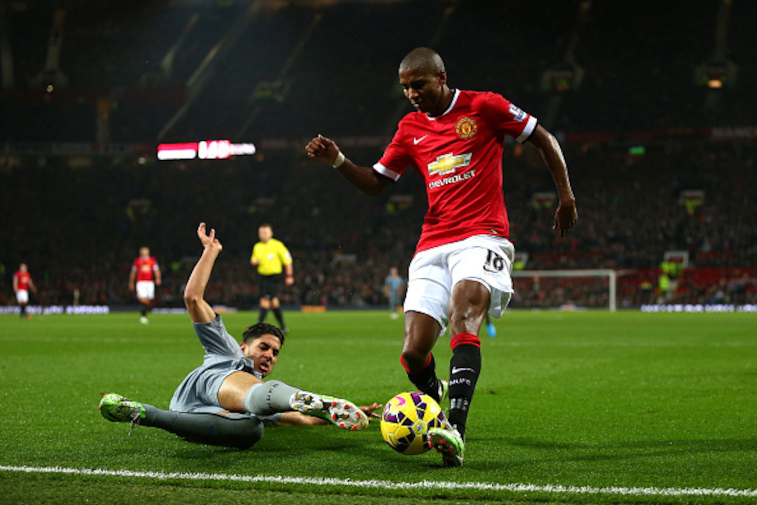 MANCHESTER, ENGLAND - DECEMBER 26:  Ashley Young of Manchester United is challenged by Ayoze Perez of Newcastle United during the Barclays Premier League match between Manchester United and Newcastle United at Old Trafford on December 26, 2014 in Manchest