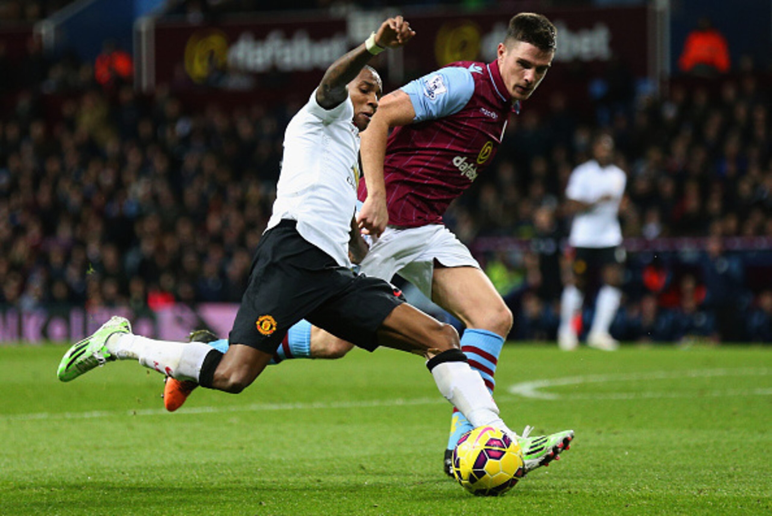 BIRMINGHAM, ENGLAND - DECEMBER 20:  Ashley Young of Manchester United is closed down by Ciaran Clark of Aston Villa during the Barclays Premier League match between Aston Villa and Manchester United at Villa Park on December 20, 2014 in Birmingham, Englan