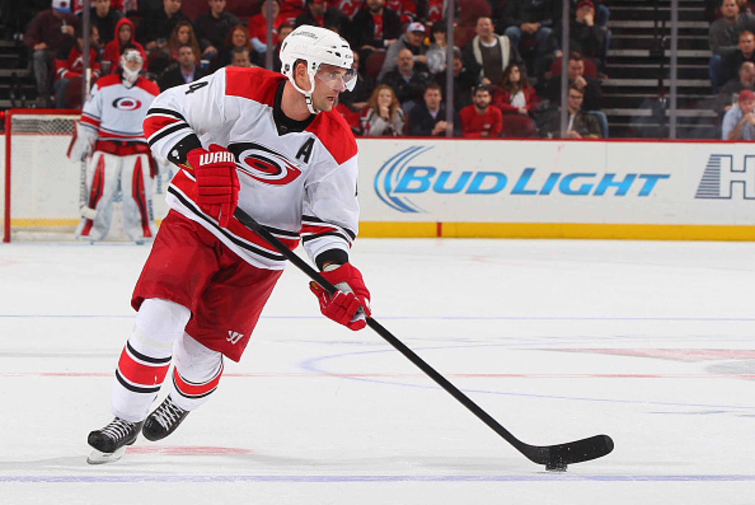 NEWARK, NJ - DECEMBER 23: Andrej Sekera #4 of the Carolina Hurricanes plays the puck against the New Jersey Devils at the Prudential Center on December 23, 2014 in Newark, New Jersey. (Photo by Andy Marlin/NHLI via Getty Images)