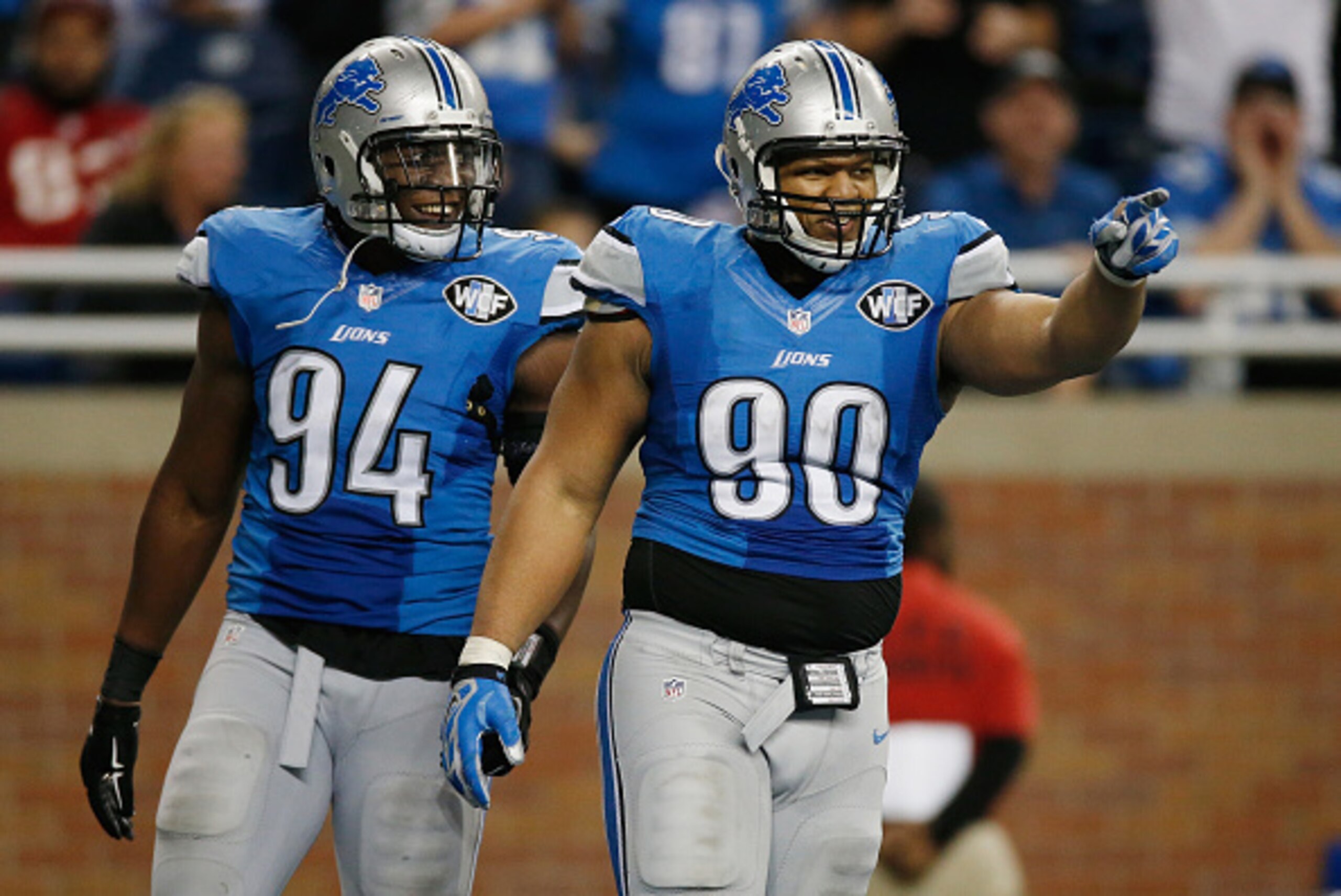 DETROIT, MI - DECEMBER 07: Ndamukong Suh #90 and Ezekiel Ansah #94 of the Detroit Lions celebrates a fourth quarter sack while playing the Tampa Bay Buccaneers at Ford Field on December 07, 2014 in Detroit, Michigan. Detroit won the game 34-17. (Photo by 