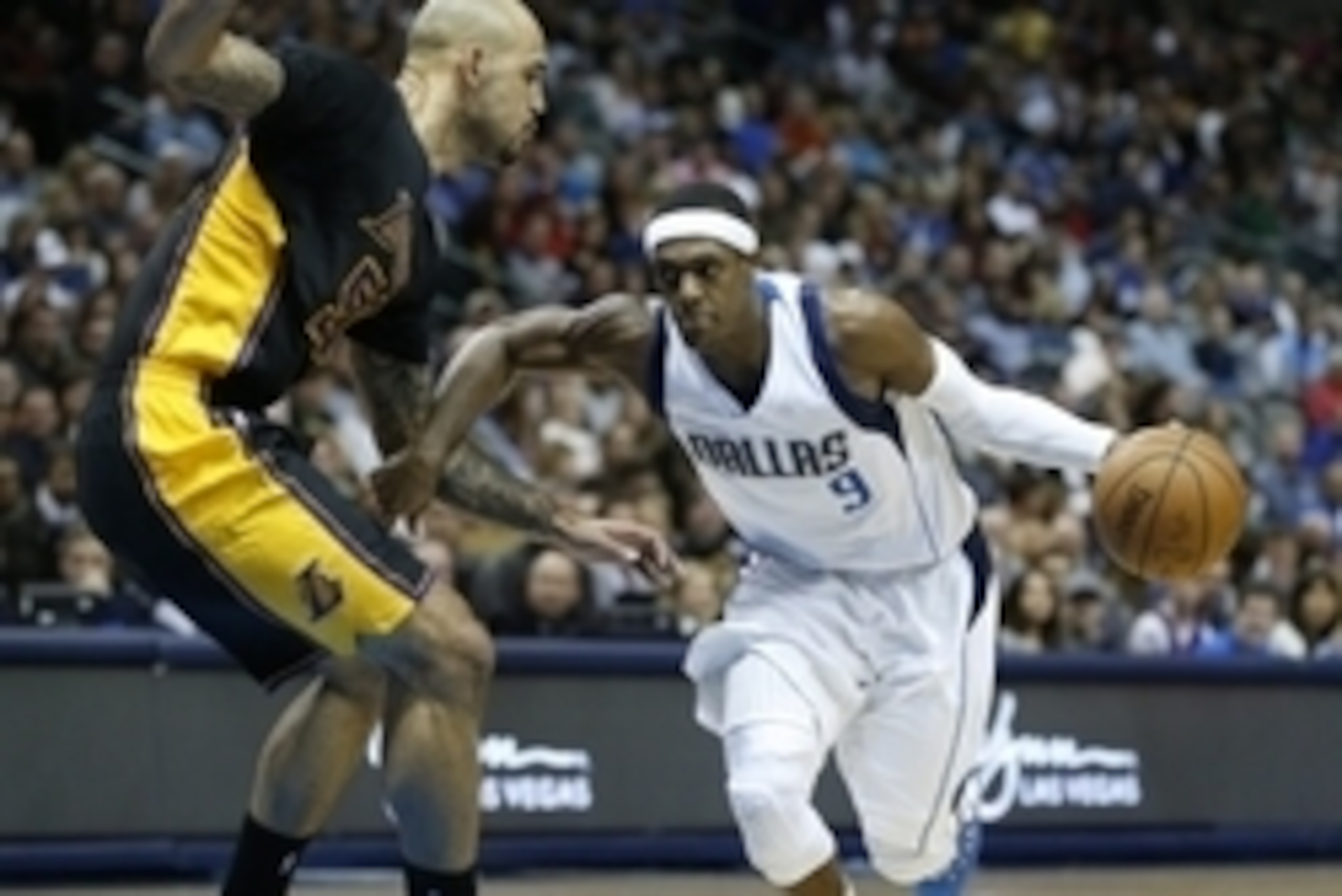 Dec 26, 2014; Dallas, TX, USA; Dallas Mavericks guard Rajon Rondo (9) drives past Los Angeles Lakers center Robert Sacre (50) during the game at American Airlines Center. Mandatory Credit: Kevin Jairaj-USA TODAY Sports