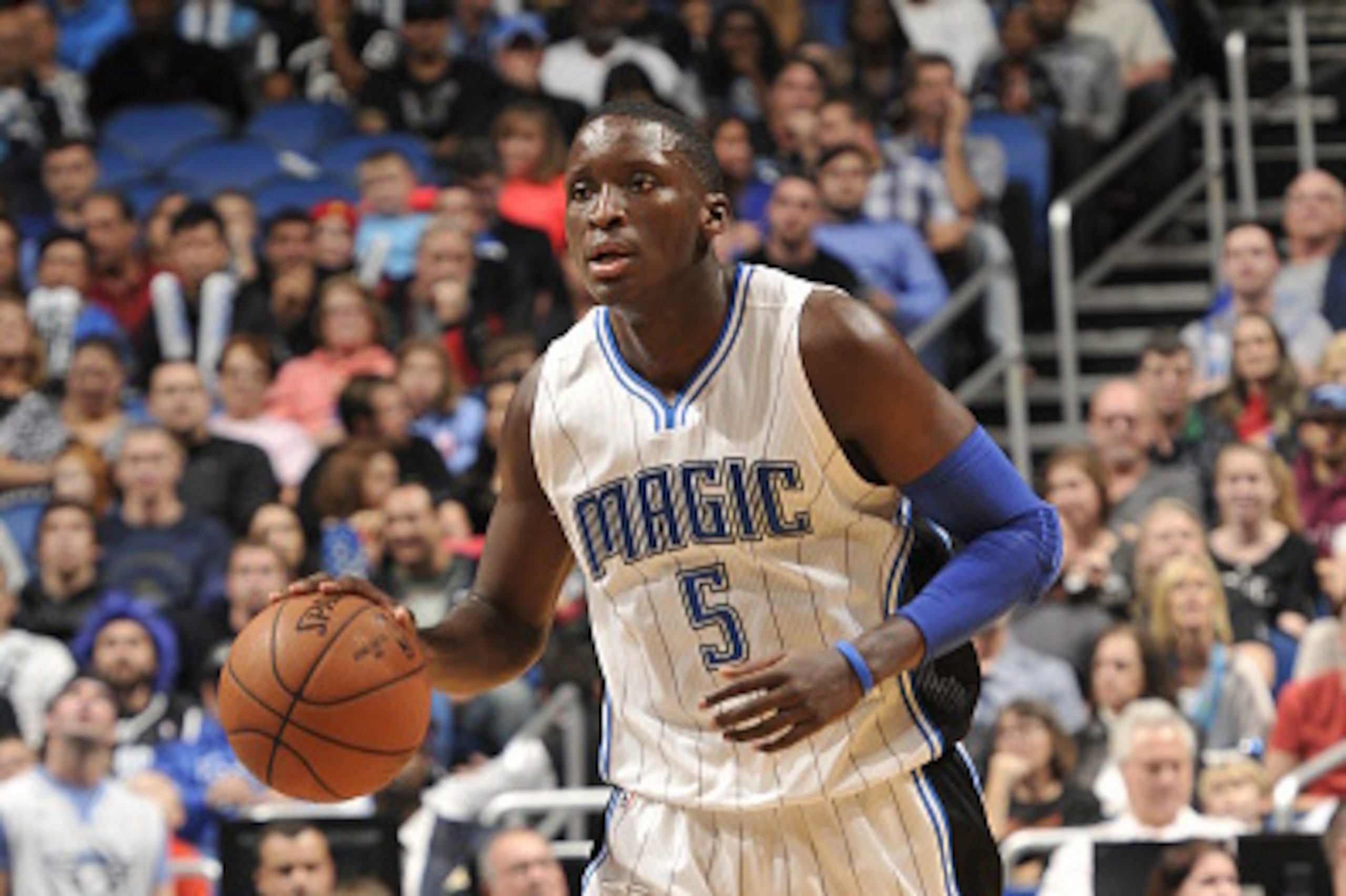 ORLANDO, FL - DECEMBER 30:  Victor Oladipo #5 of the Orlando Magic brings the ball up court against the Detroit Pistons on December 30, 2014 at Amway Center in Orlando, Florida. NOTE TO USER: User expressly acknowledges and agrees that, by downloading and