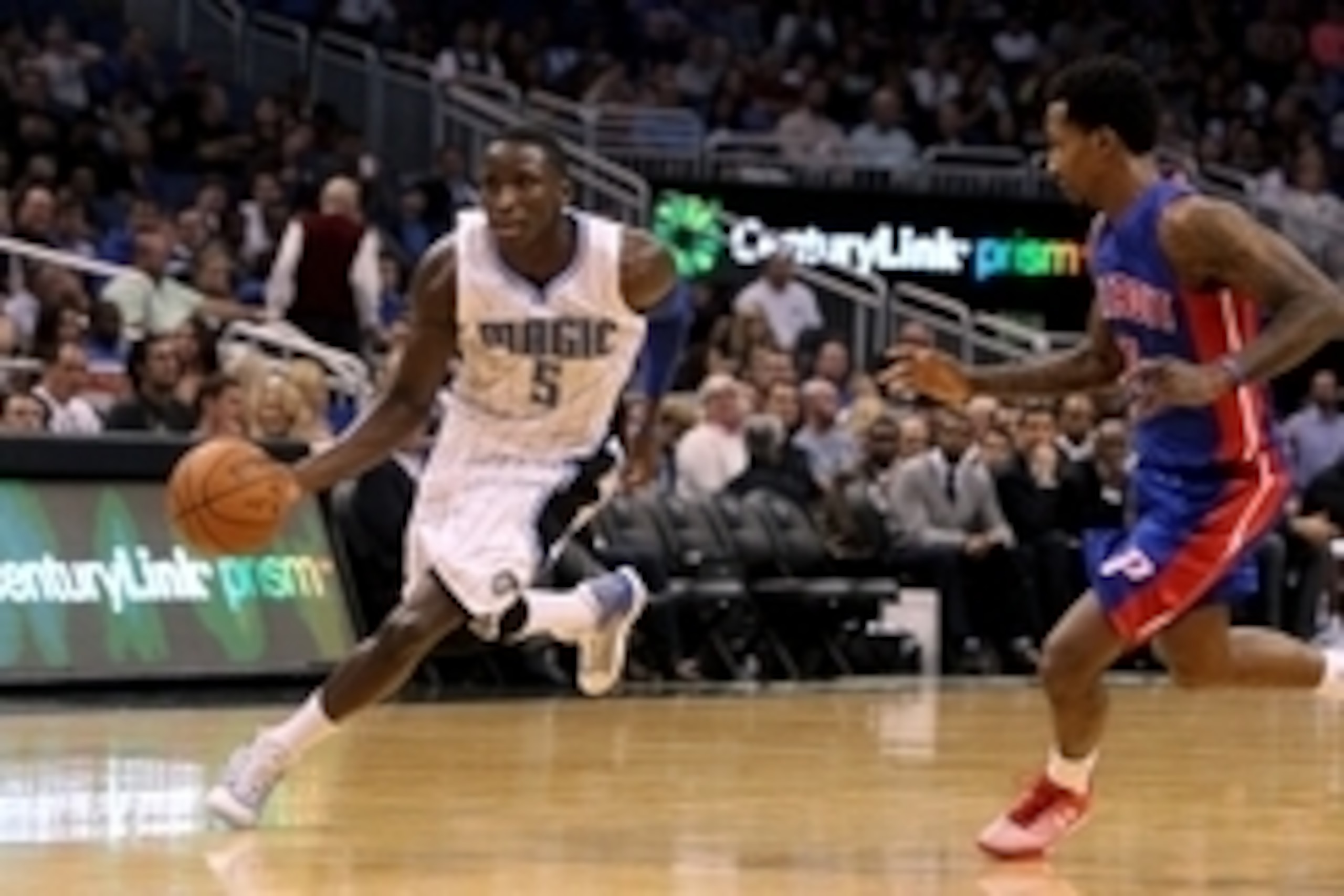 Dec 30, 2014; Orlando, FL, USA; Orlando Magic guard Victor Oladipo (5) dribbles as Detroit Pistons guard Brandon Jennings (7) defends during the second half at Amway Center. Detroit Pistons defeated the Orlando Magic 109-86. Mandatory Credit: Kim Klement-