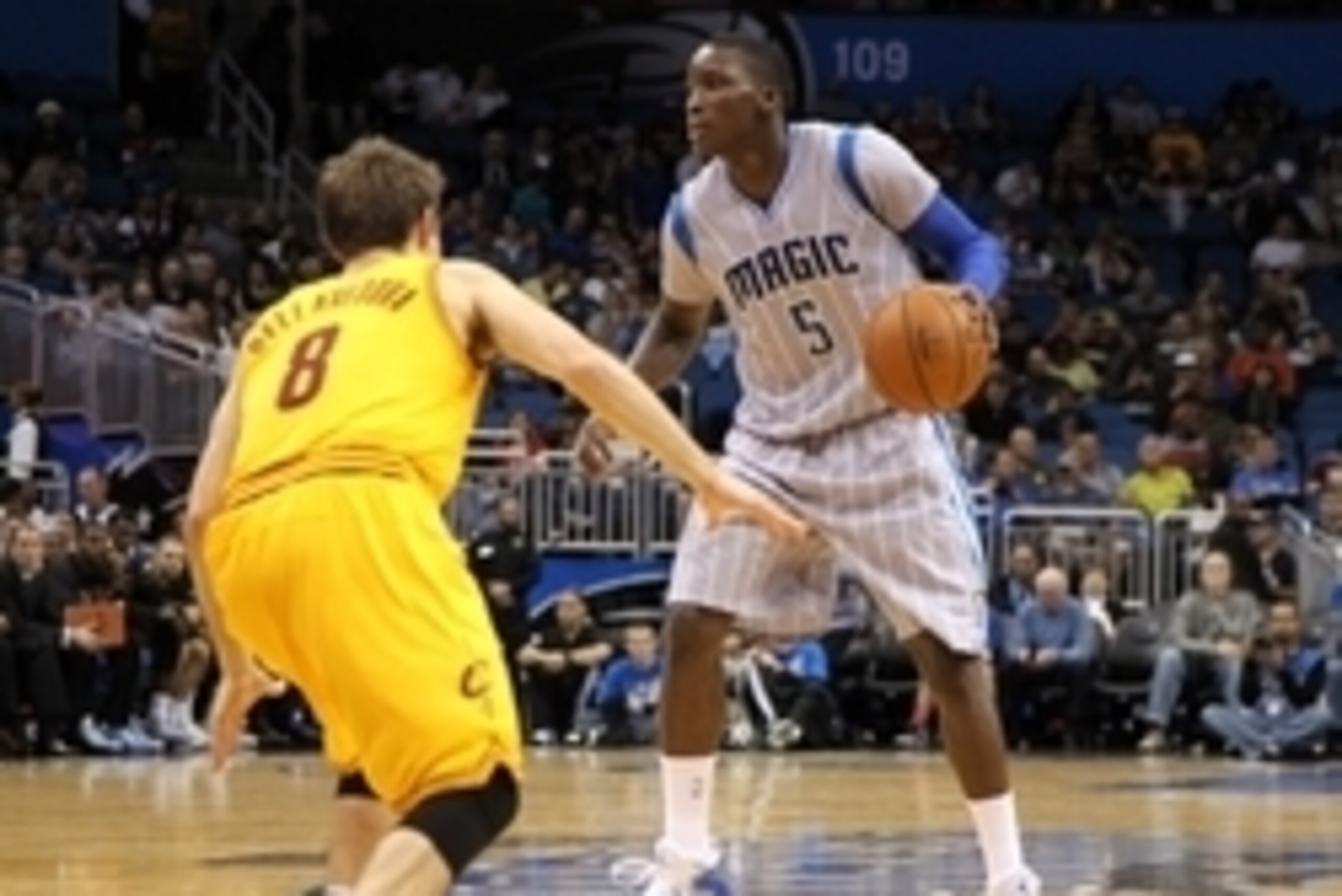 Dec 26, 2014; Orlando, FL, USA; Orlando Magic guard Victor Oladipo (5) drives to the basket as Cleveland Cavaliers guard Matthew Dellavedova (8) defends during the second half at Amway Center. Cleveland Cavaliers defeated the Orlando Magic 98-89. Mandator