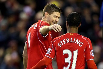LIVERPOOL, ENGLAND - JANUARY 01:  Steven Gerrard of Liverpool celebrateswith teammate Raheem Sterling of Liverpool after scoring his team's second goal from the penalty spot during the Barclays Premier League match between Liverpool and Leicester City at 
