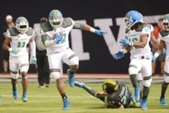 Jan 2, 2015; St. Petersburg, FL, USA; Team Highlight defensive tackle Christian Wilkins (42) returns a blocked extra point for a score against Team Armour during the first half of the  2015 Under Armour All-America Game at Tropicana Field. Mandatory Credi