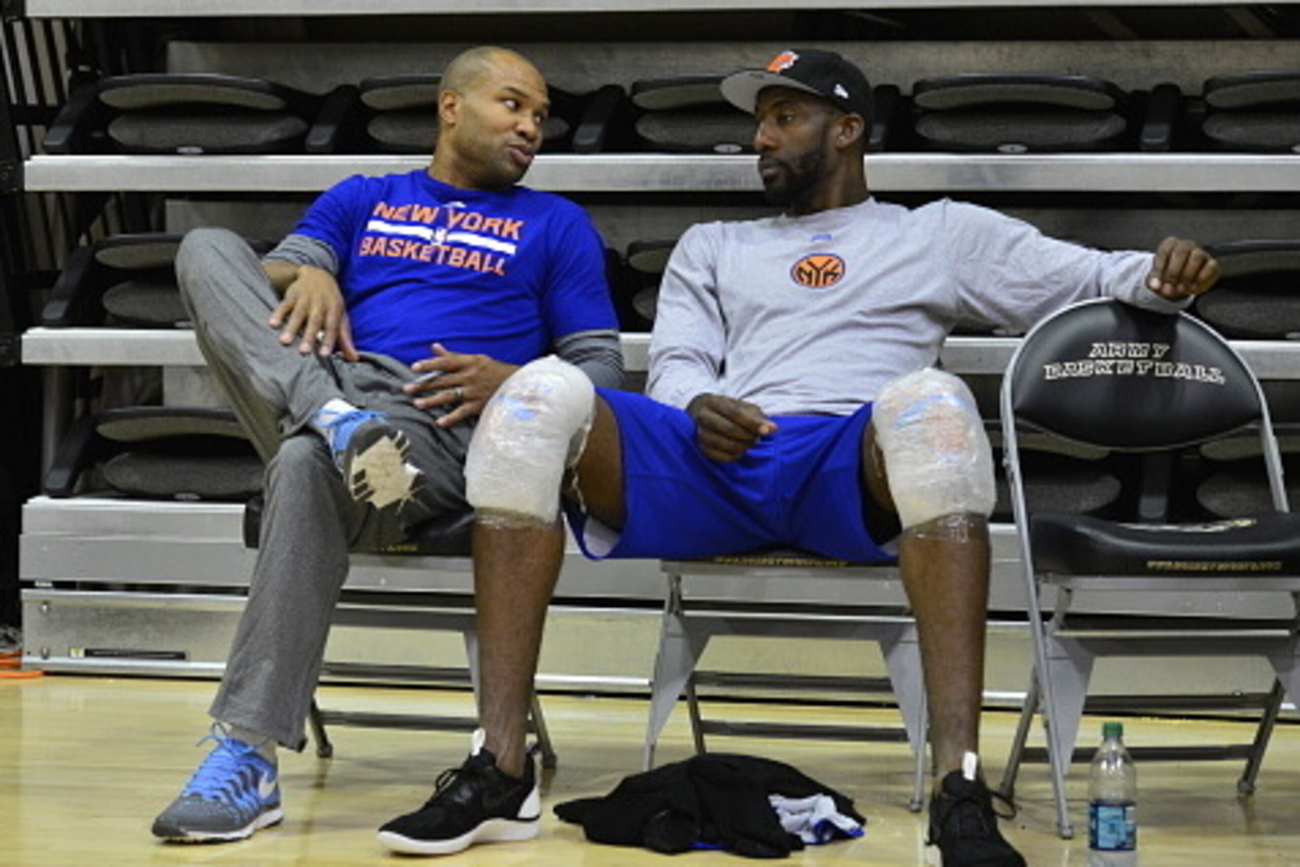 WEST POINT, NY - SEPTEMBER 30:  (L-R) Head coach Derek Fisher and Amar'e Stoudemire #1 of the New York Knicks talk during practice at West Point Military Academy on September 30, 2014 in West Point, New York. NOTE TO USER: User expressly acknowledges and