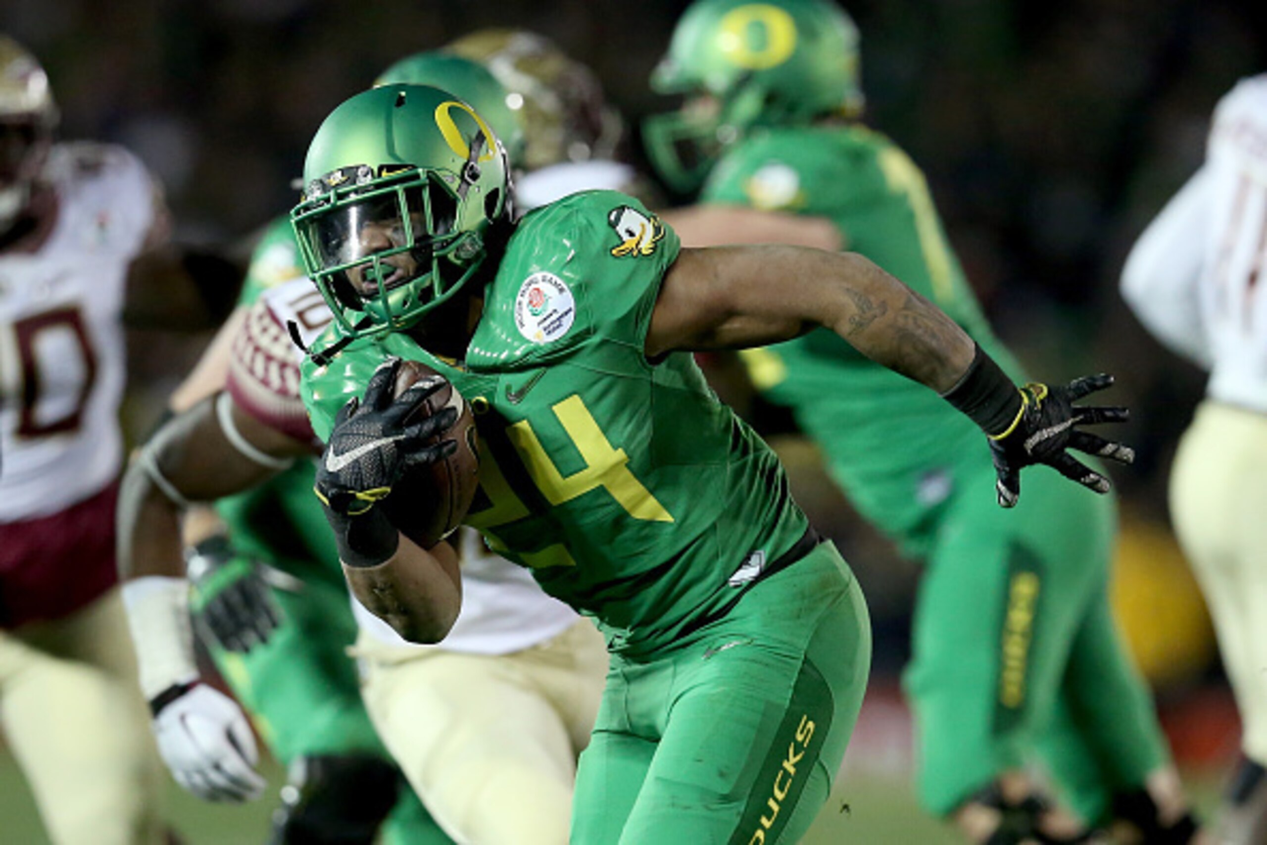 PASADENA, CA - JANUARY 01:  Running back Thomas Tyner #24 of the Oregon Ducks rushes with the ball against the Florida State Seminoles during the College Football Playoff Semifinal at the Rose Bowl Game presented by Northwestern Mutual at the Rose Bowl on