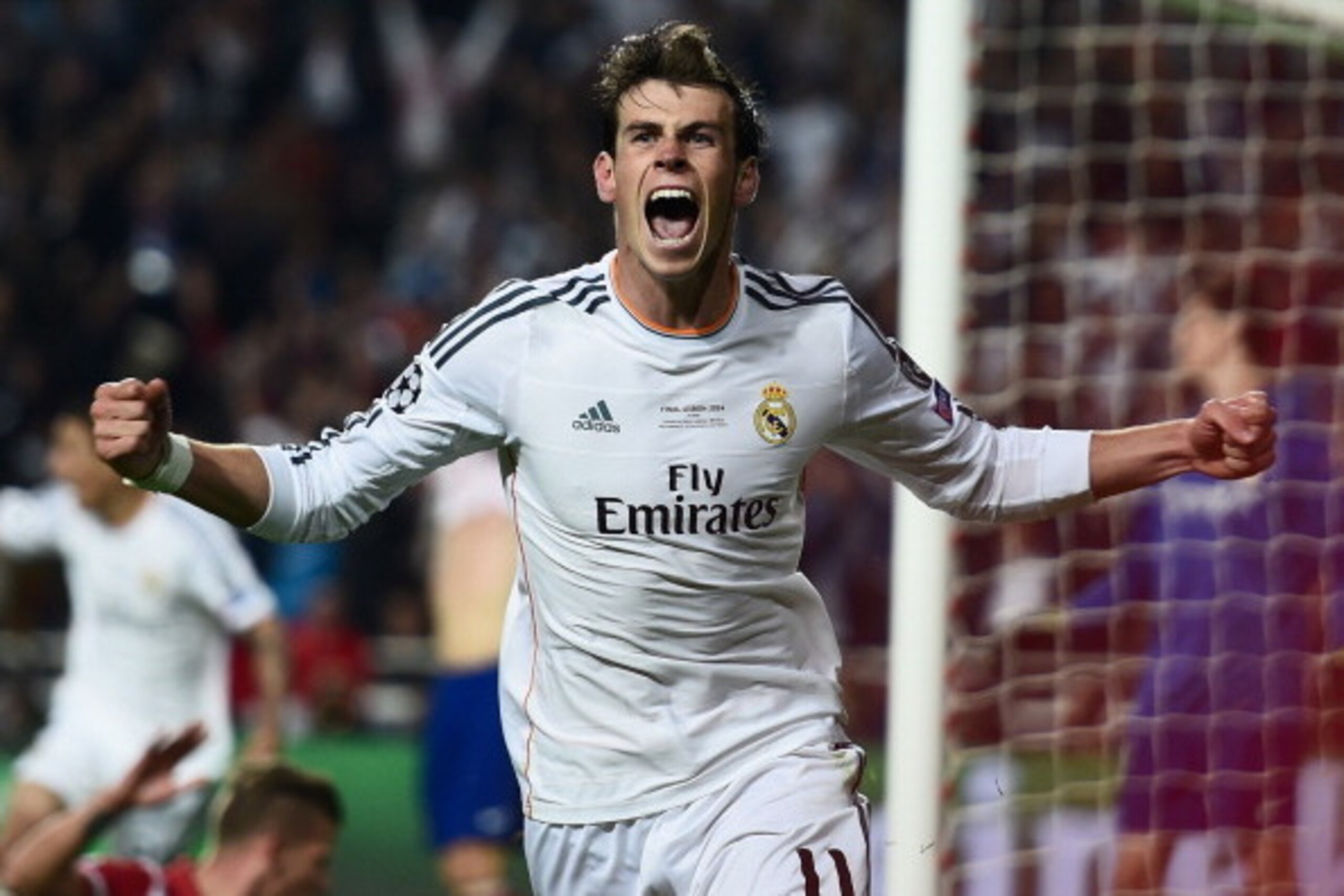 LISBON, PORTUGAL - MAY 24: Gareth Bale of Real Madrid celebrates scoring their second goal in extra time during the UEFA Champions League Final between Real Madrid and Atletico de Madrid at Estadio da Luz on May 24, 2014 in Lisbon, Portugal. (Photo by S LISBON, PORTUGAL - MAY 24: Gareth Bale of Real Madrid celebrates scoring their second goal in extra time during the UEFA Champions League Final between Real Madrid and Atletico de Madrid at Estadio da Luz on May 24, 2014 in Lisbon, Portugal. (Photo by S