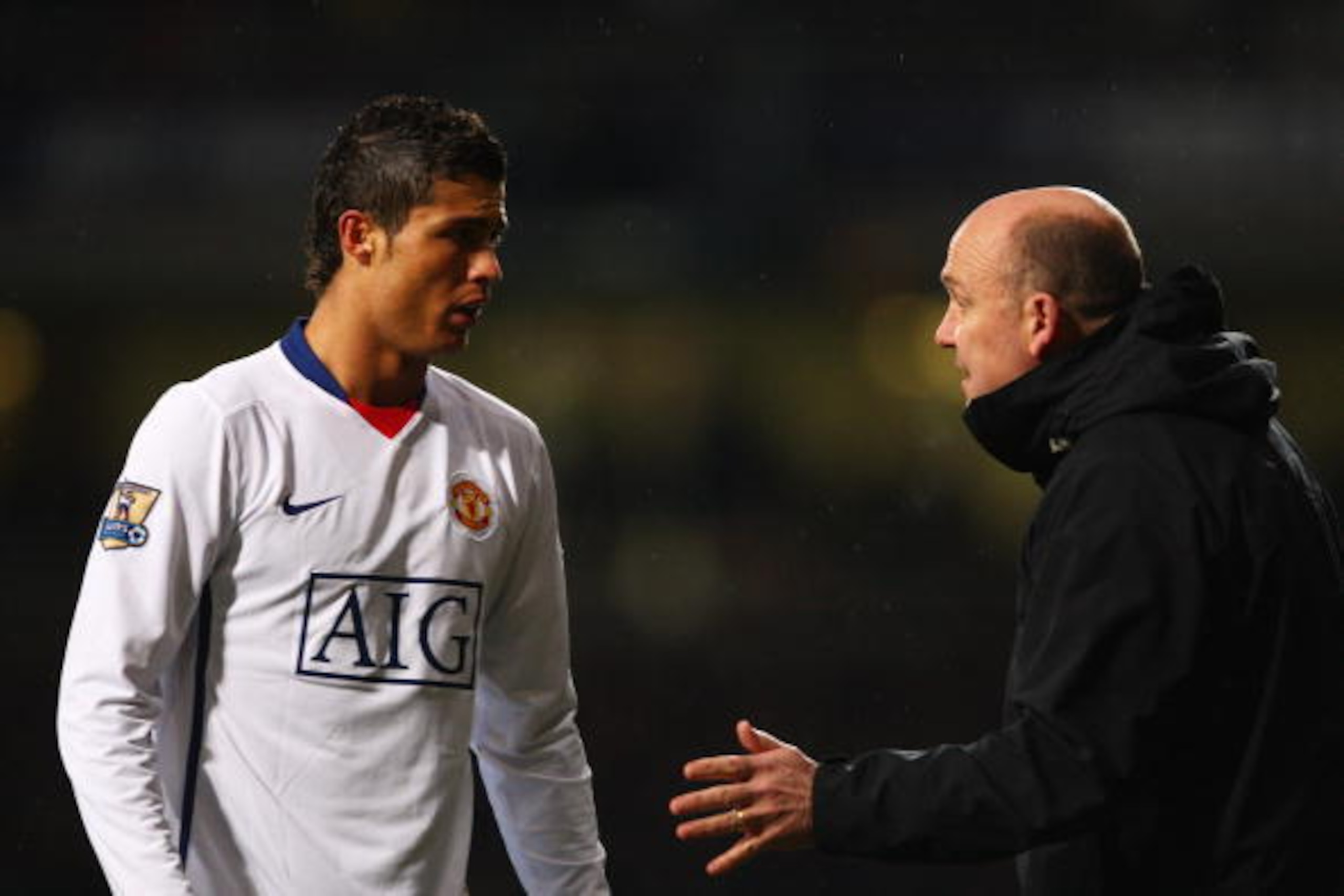 LONDON - FEBRUARY 08: Manchester United Assistant Manager Mike Phelan talks to Cristiano Ronaldo of Manchester United during the Barclays Premier League match between West Ham United and Manchester United at Upton Park on February 8, 2009 in London, Engla