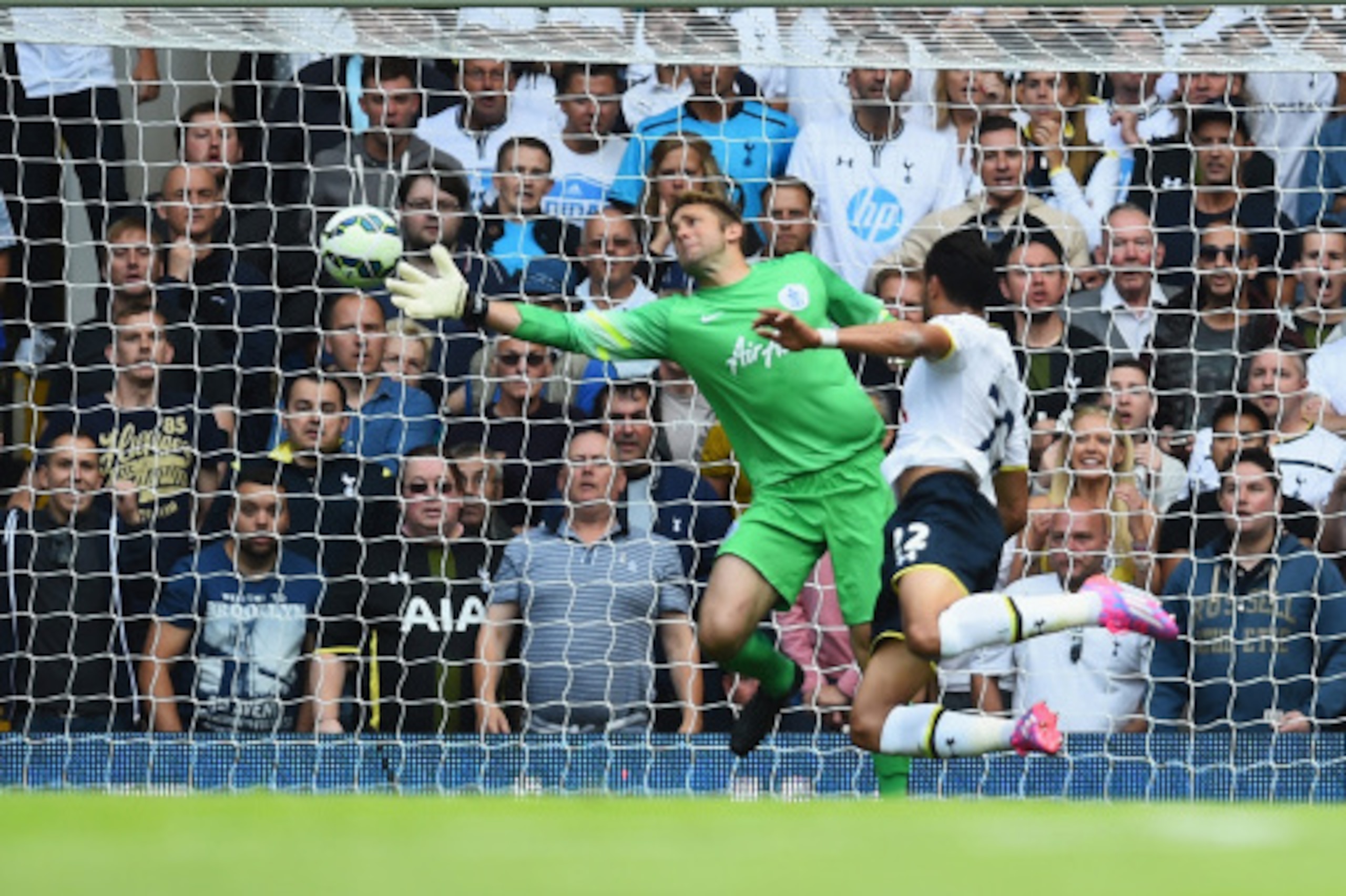LONDON, ENGLAND - AUGUST 24:  Nacer Chadli of Spurs heads past Robert Green of QPR to score his team's third goal during the Barclays Premier League match between Tottenham Hotspur and Queens Park Rangers at White Hart Lane on August 24, 2014 in London, E