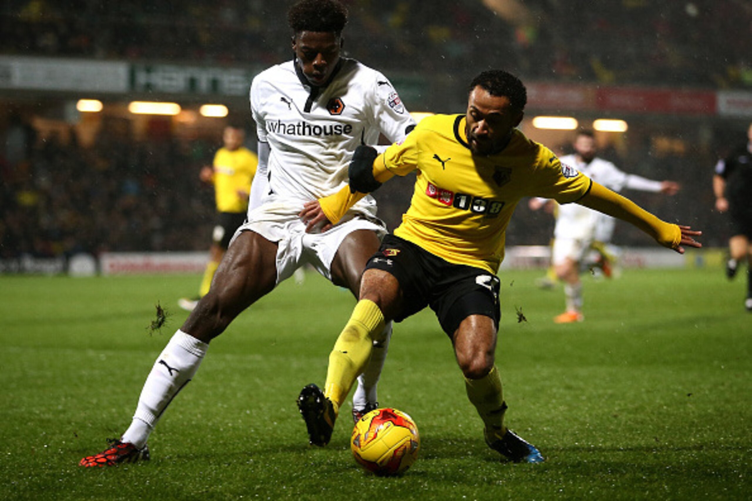 WATFORD, ENGLAND - DECEMBER 26:  Dominic Iorfa tackles for the ball with Ikechi Anya of Wolves during the Sky Bet Championship match between Watford and Wolverhampton Wanderers at Vicarage Road on December 26, 2014 in Watford, England.  (Photo by Jordan M