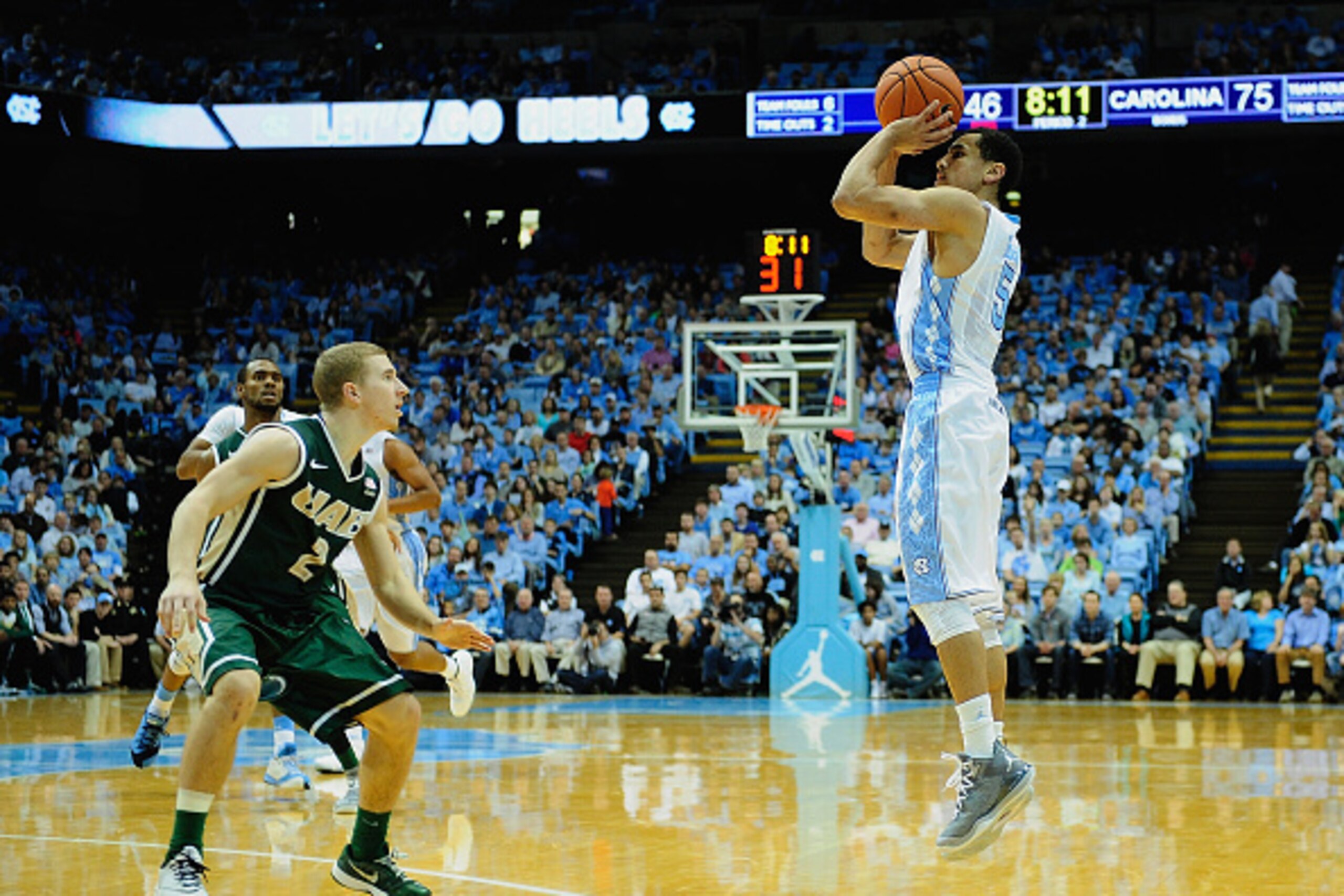 CHAPEL HILL, NC - DECEMBER 27:  Marcus Paige #5 of the North Carolina Tar Heels takes a three-point shot against the UAB Blazers during their game at the Dean Smith Center on December 27, 2014 in Chapel Hill, North Carolina. North Carolina won 89-58.  (Ph