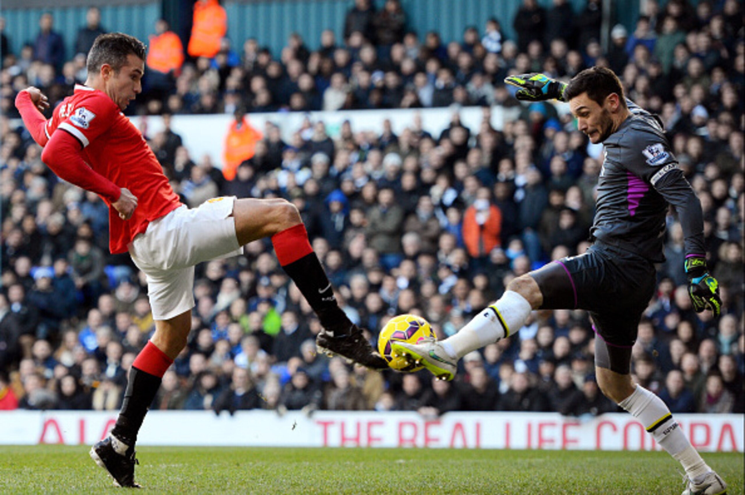 LONDON, ENGLAND - DECEMBER 28:  Robin van Persie of Manchester United has his attempt on goal saved by goalkeeper Hugo Lloris of Spurs during the Barclays Premier League match between Tottenham Hotspur and Manchester United at White Hart Lane on December 