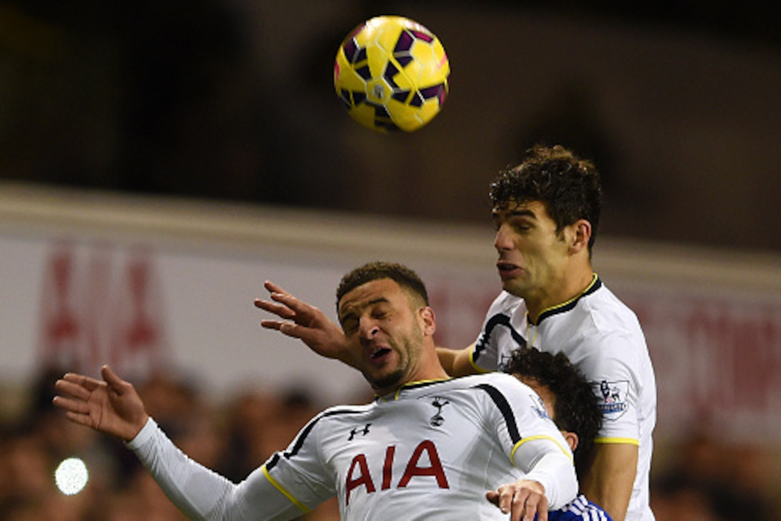 LONDON, ENGLAND - JANUARY 01:  Diego Costa of Chelsea is caught between Kyle Walker and Federico Fazio of Spurs as he jumps for the ball during the Barclays Premier League match between Tottenham Hotspur and Chelsea at White Hart Lane on January 1, 2015 i