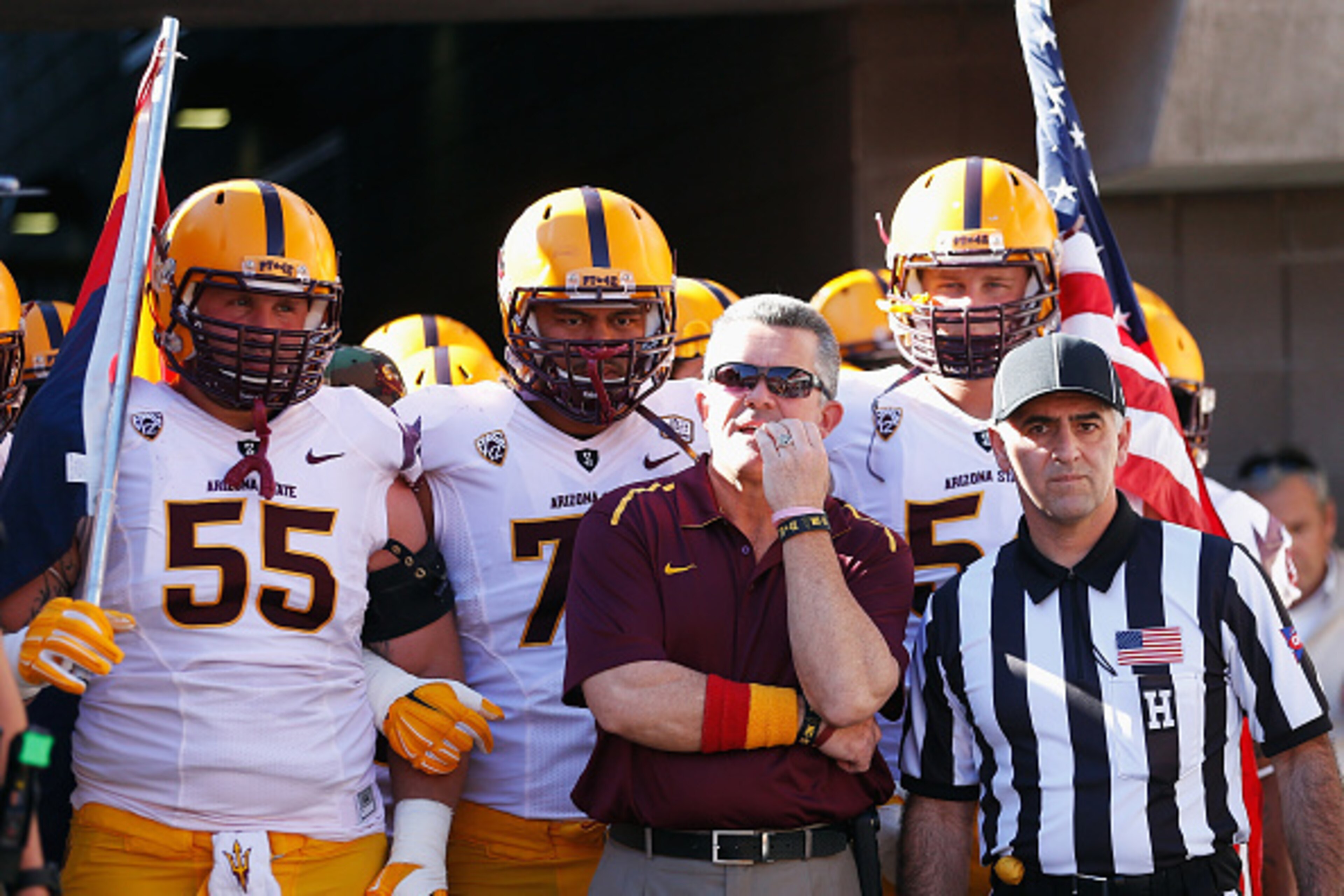 TUCSON, AZ - NOVEMBER 28:  Head coach Todd Graham of the Arizona State Sun Devils stands with his team before taking the field for the Territorial Cup college football game against the Arizona Wildcats at Arizona Stadium on November 28, 2014 in Tucson, Ar