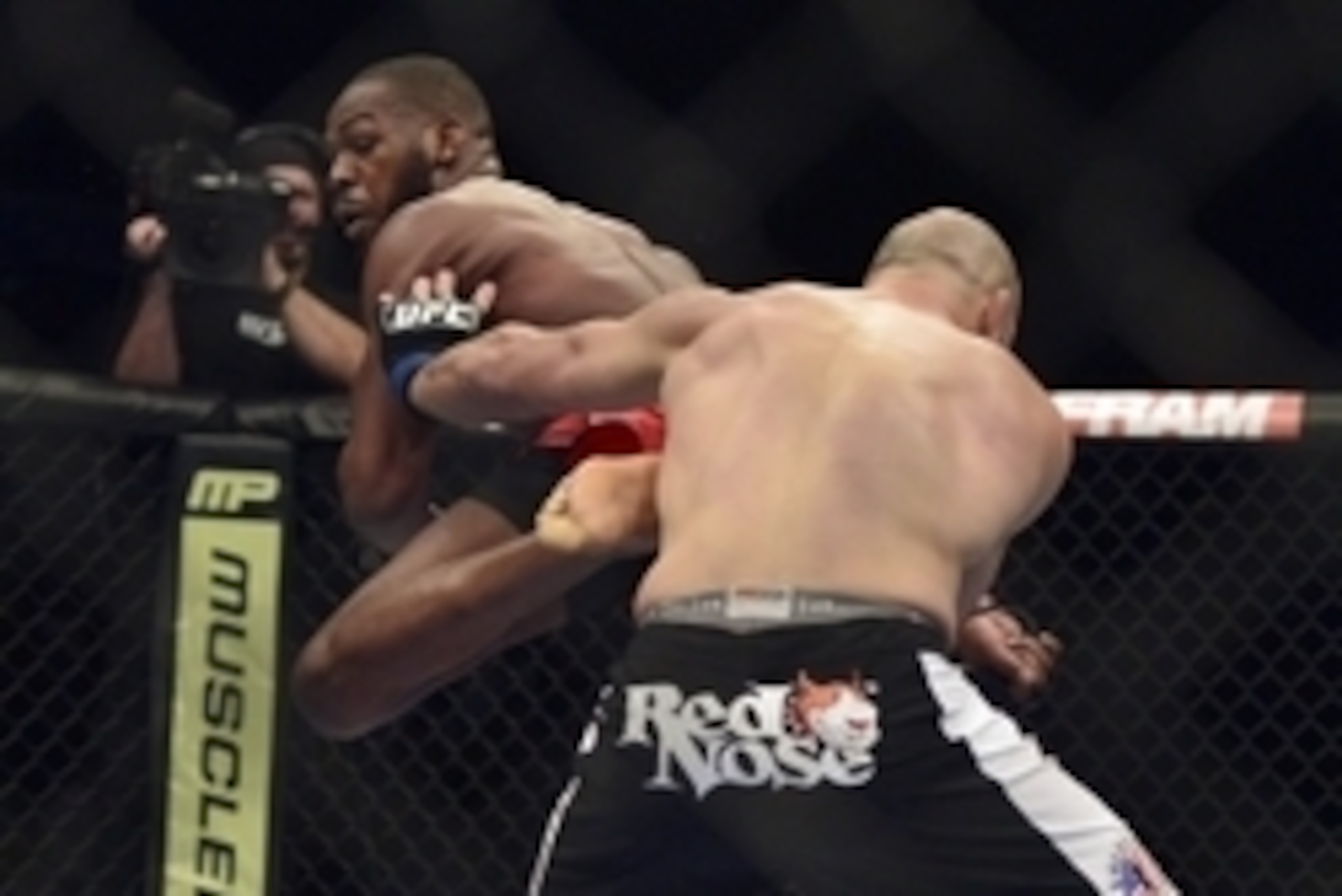 Apr 26, 2014; Baltimore, MD, USA;  Jon Jones kicks Glover Teixeira in the head during the UFC light heavy weight championship fight at  Baltimore Arena. Jones retained the light heavy height championship by defeating  Teixeria.  Mandatory Credit: Tommy Gi