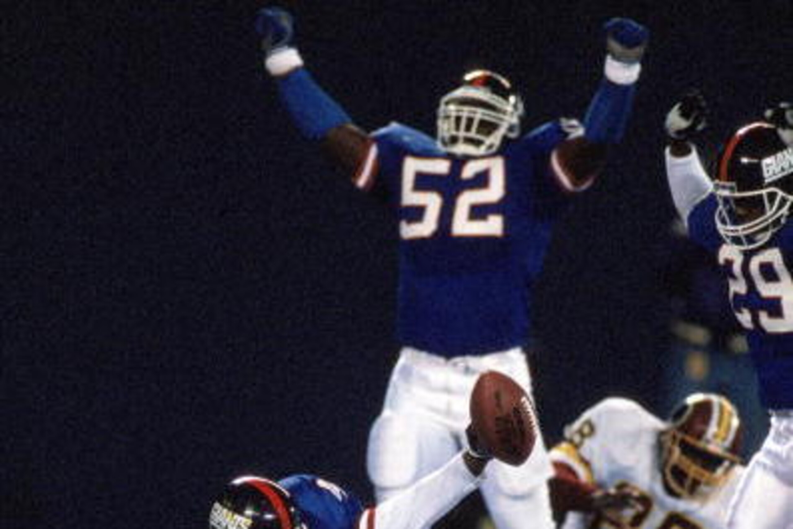 EAST RUTHERFORD, NJ - OCTOBER 28: Linebacker Pepper Johnson #52 and safety Myron Guyton #29 of the New York Giants celebrate after the end zone interception by teammate Greg Jackson #47 during a game against the Washington Redskins at Giants Stadium Octo EAST RUTHERFORD, NJ - OCTOBER 28: Linebacker Pepper Johnson #52 and safety Myron Guyton #29 of the New York Giants celebrate after the end zone interception by teammate Greg Jackson #47 during a game against the Washington Redskins at Giants Stadium Octo