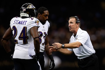 NEW ORLEANS, LA - NOVEMBER 24:  Defensive coordinator Steve Spagnuolo of the Baltimore Ravens speaks with Darian Stewart #24 and Will Hill #33 during the second quarter of a game against the New Orleans Saintsat the Mercedes-Benz Superdome on November 24,