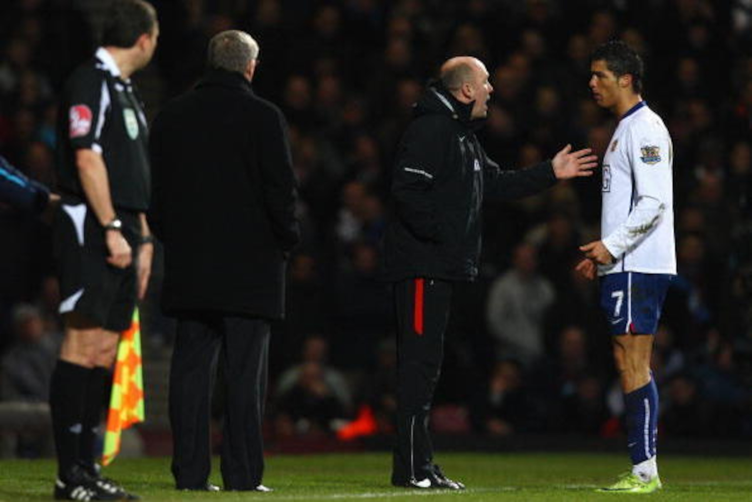 LONDON - FEBRUARY 08:  Manchester United Assistant Manager Mike Phelan talks to Cristiano Ronaldo of Manchester United during the Barclays Premier League match between West Ham United and Manchester United at Upton Park on February 8, 2009 in London, Engl