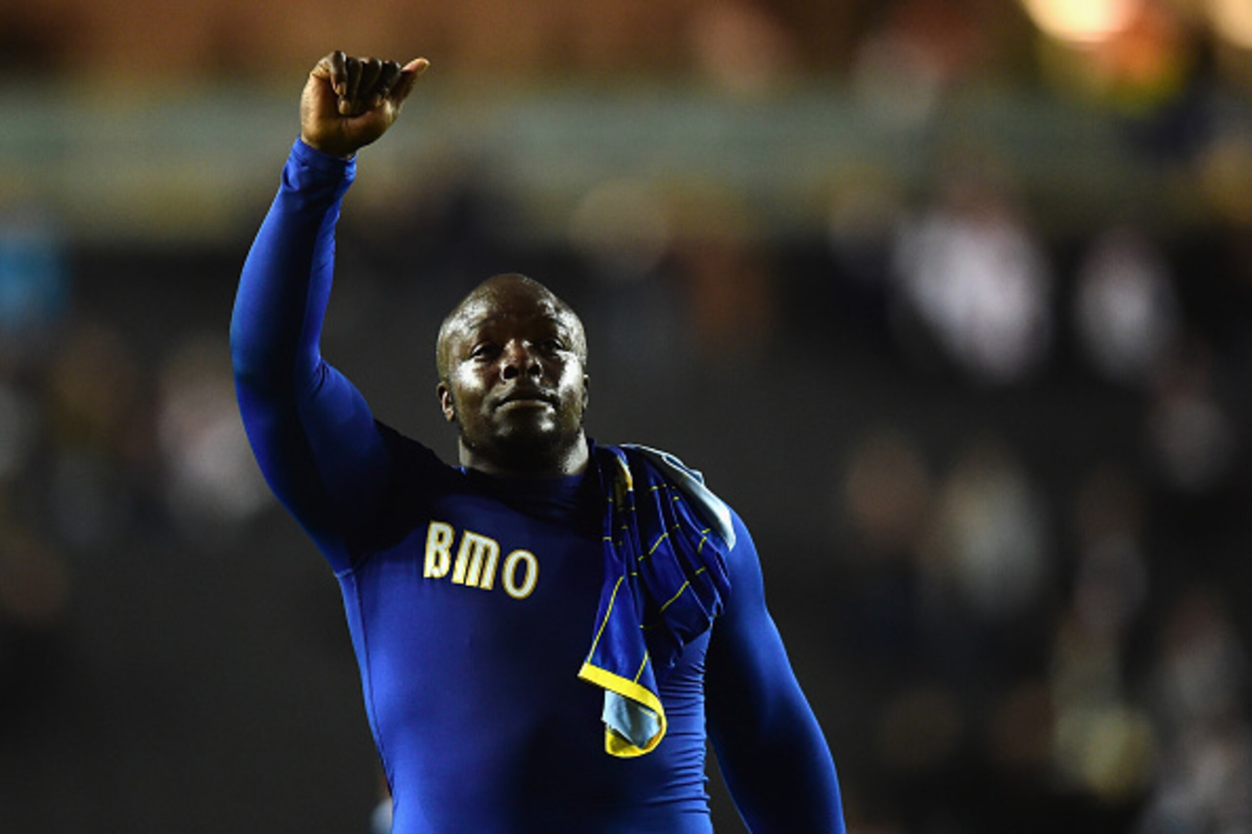 MILTON KEYNES, ENGLAND - OCTOBER 07:  Adebayo Akinfenwa of AFC Wimbledon celebrates victory during the Johnstone's Paint Trophy Southern Section Second Round match between MK Dons and AFC Wimbledon at Stadium mk on October 7, 2014 in Milton Keynes, Englan