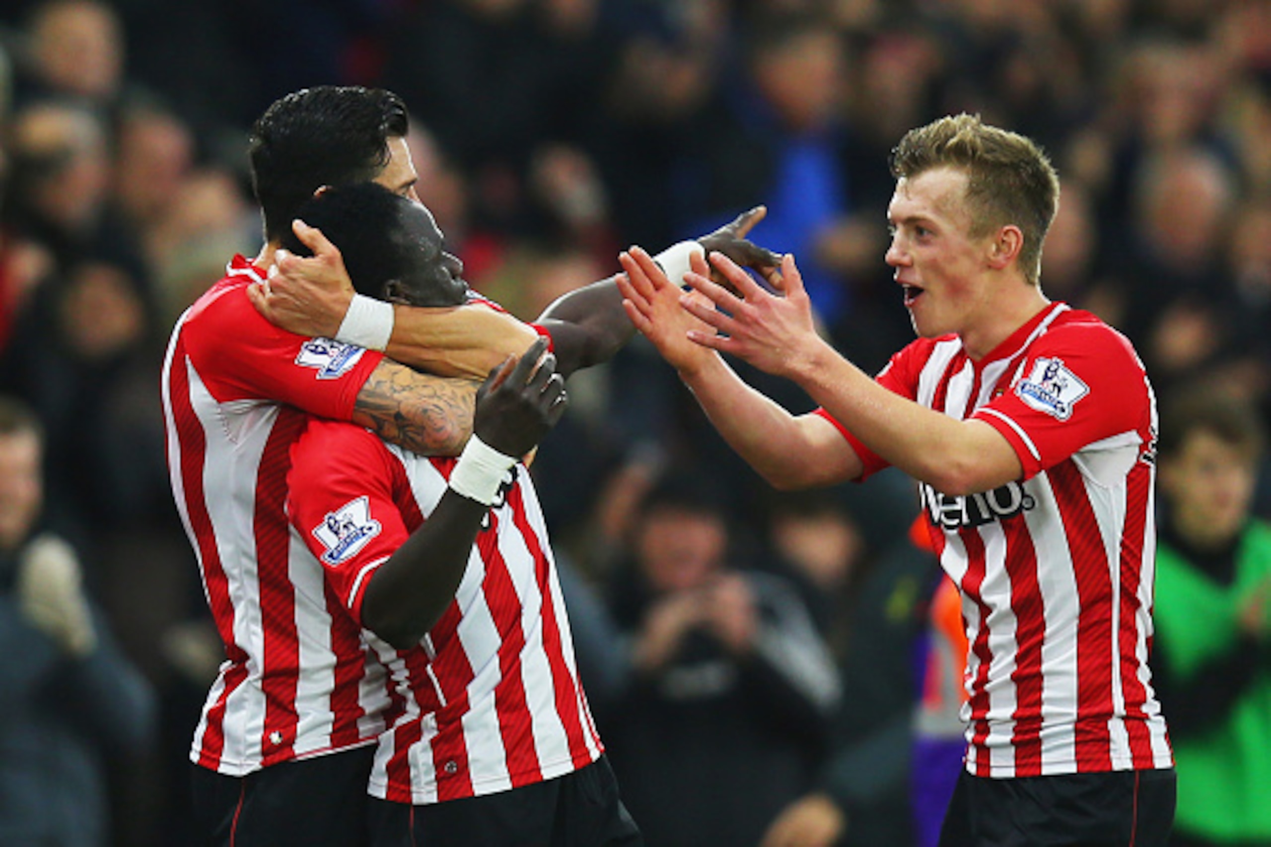 SOUTHAMPTON, ENGLAND - JANUARY 01:  Sadio Mane of Southampton (C) celebrates with team mates Graziano Pelle (L) and James Ward-Prowse (R) as he scores their first goal during the Barclays Premier League match between Southampton and Arsenal at St Mary's S
