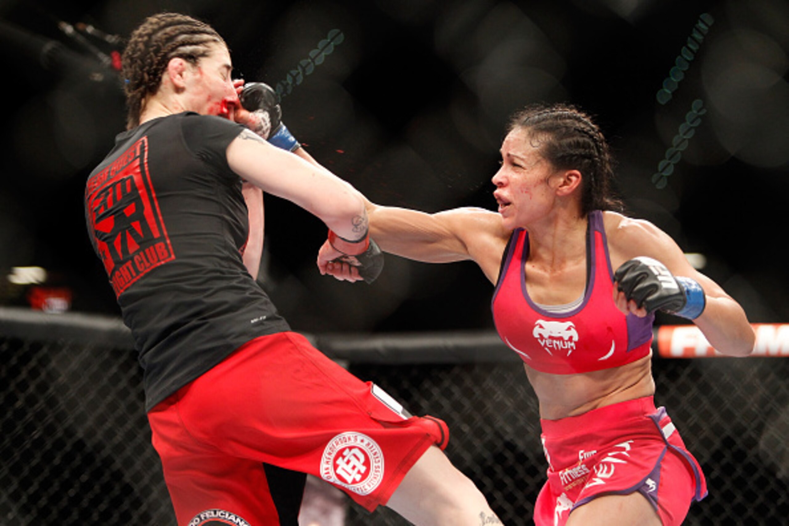LAS VEGAS, NV - JANUARY 03:  Marion Reneau (R) punches Alexis Dufresne during UFC 182 on January 3, 2015 at the MGM Grand Garden Arena in Las Vegas, Nevada.  (Photo by Steve Marcus/Getty Images)