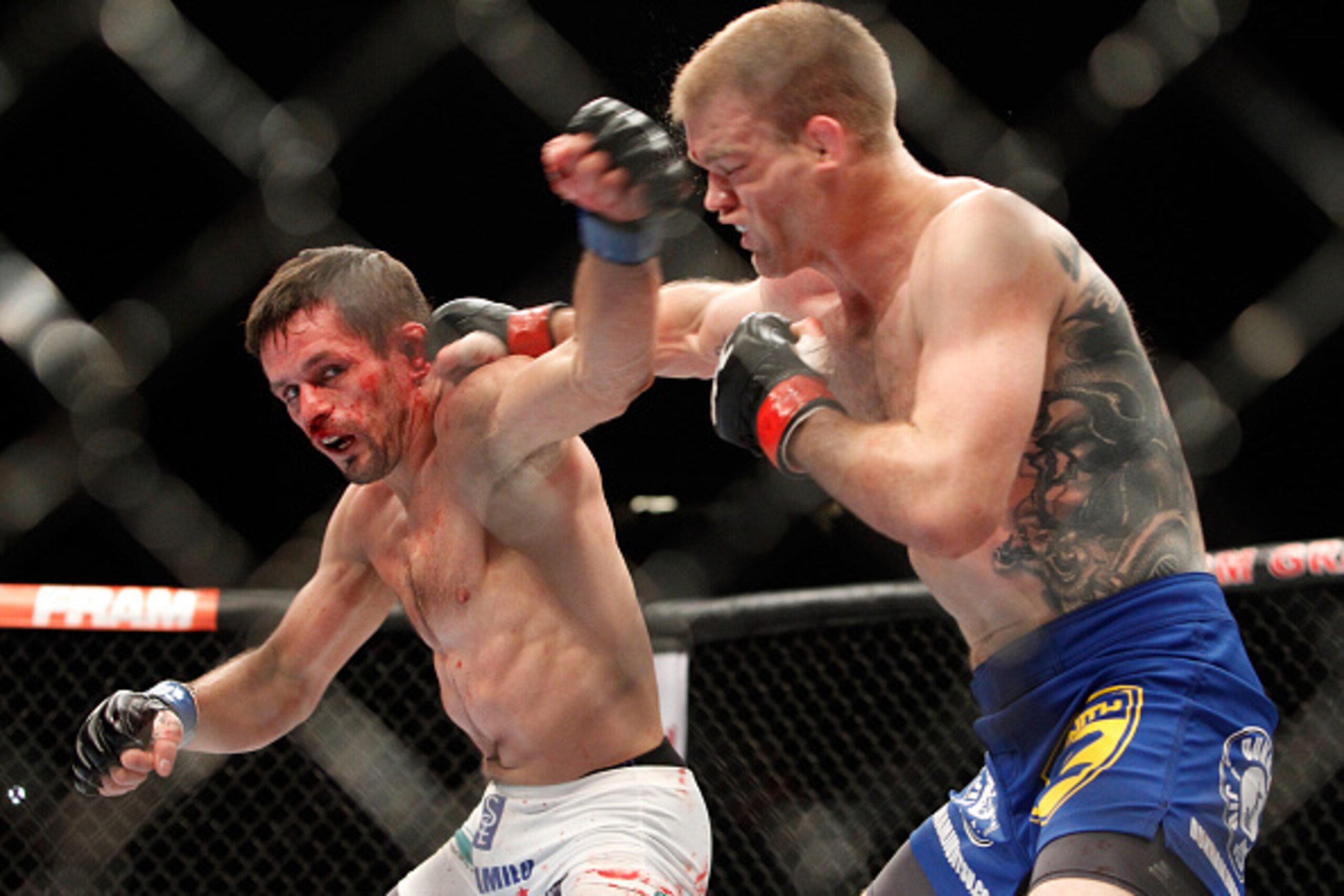 LAS VEGAS, NV - JANUARY 03:  Rodrigo Damm (L) battles with Evan Dunham in their lightweight bout during the UFC 182 event at the MGM Grand Garden Arena on January 3, 2015 in Las Vegas, Nevada. Dunham won in a unanimous decision.  (Photo by Steve Marcus/Ge