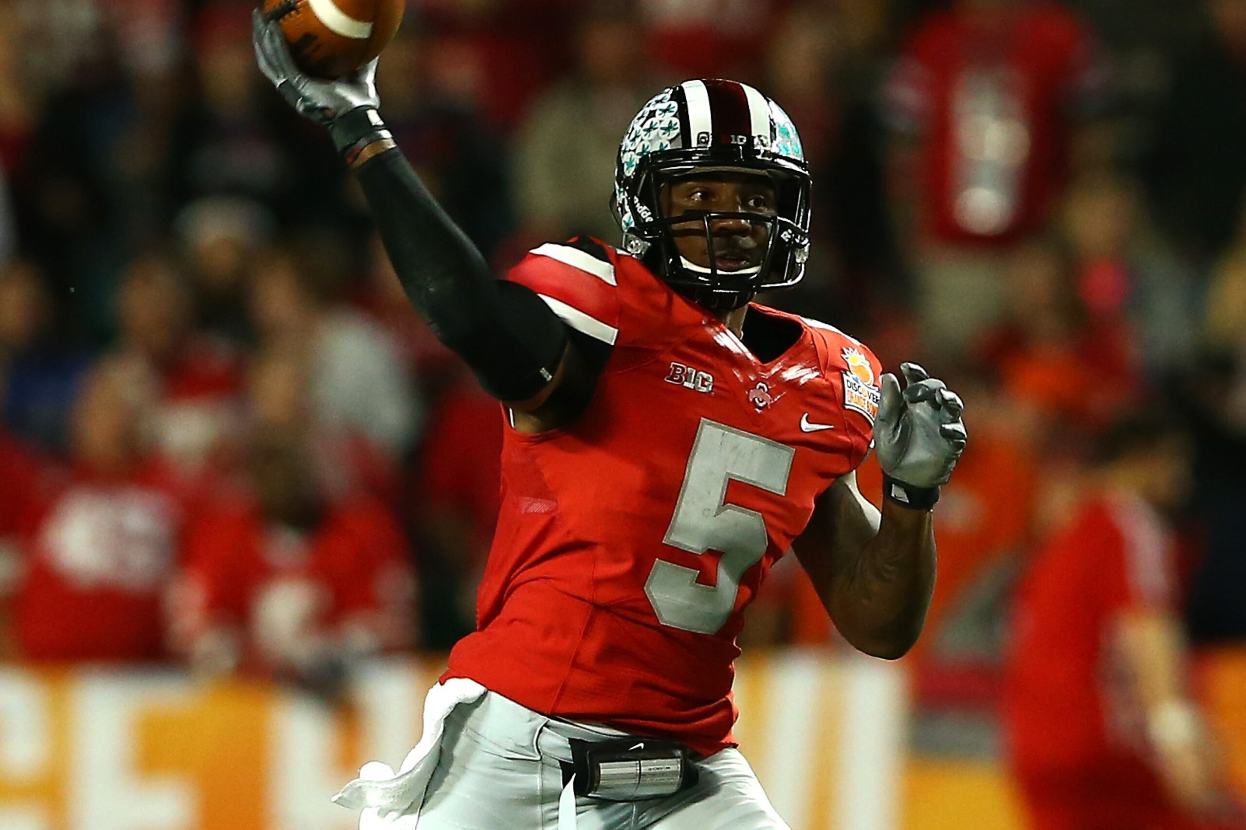 MIAMI GARDENS, FL - JANUARY 03: Braxton Miller #5 of the Ohio State Buckeyes looks to pass against the Clemson Tigers during the Discover Orange Bowl at Sun Life Stadium on January 3, 2014 in Miami Gardens, Florida.  (Photo by Streeter Lecka/Getty Images)