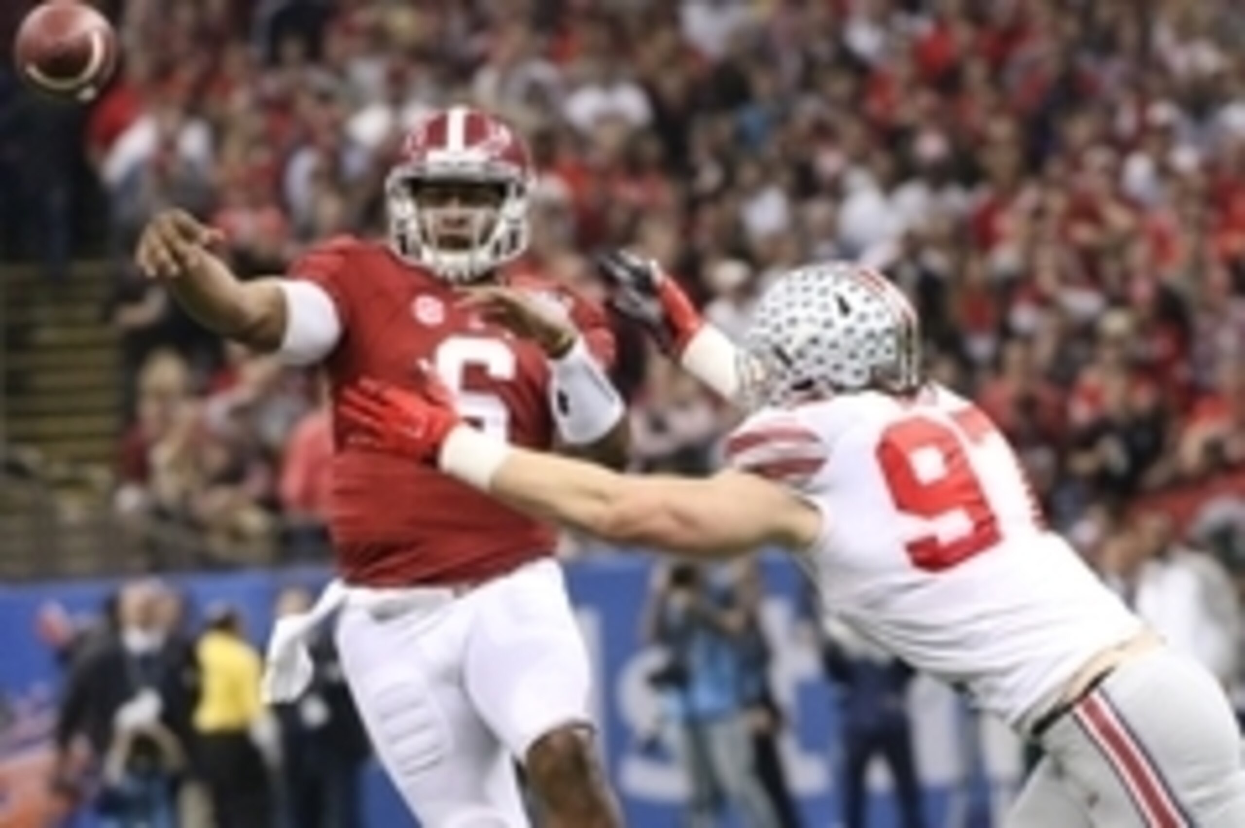 Jan 1, 2015; New Orleans, LA, USA; Alabama Crimson Tide quarterback Blake Sims (6) passes the ball while defended by Ohio State Buckeyes defensive lineman Joey Bosa (97) during the first half of the 2015 Sugar Bowl at Mercedes-Benz Superdome. Mandatory Cr