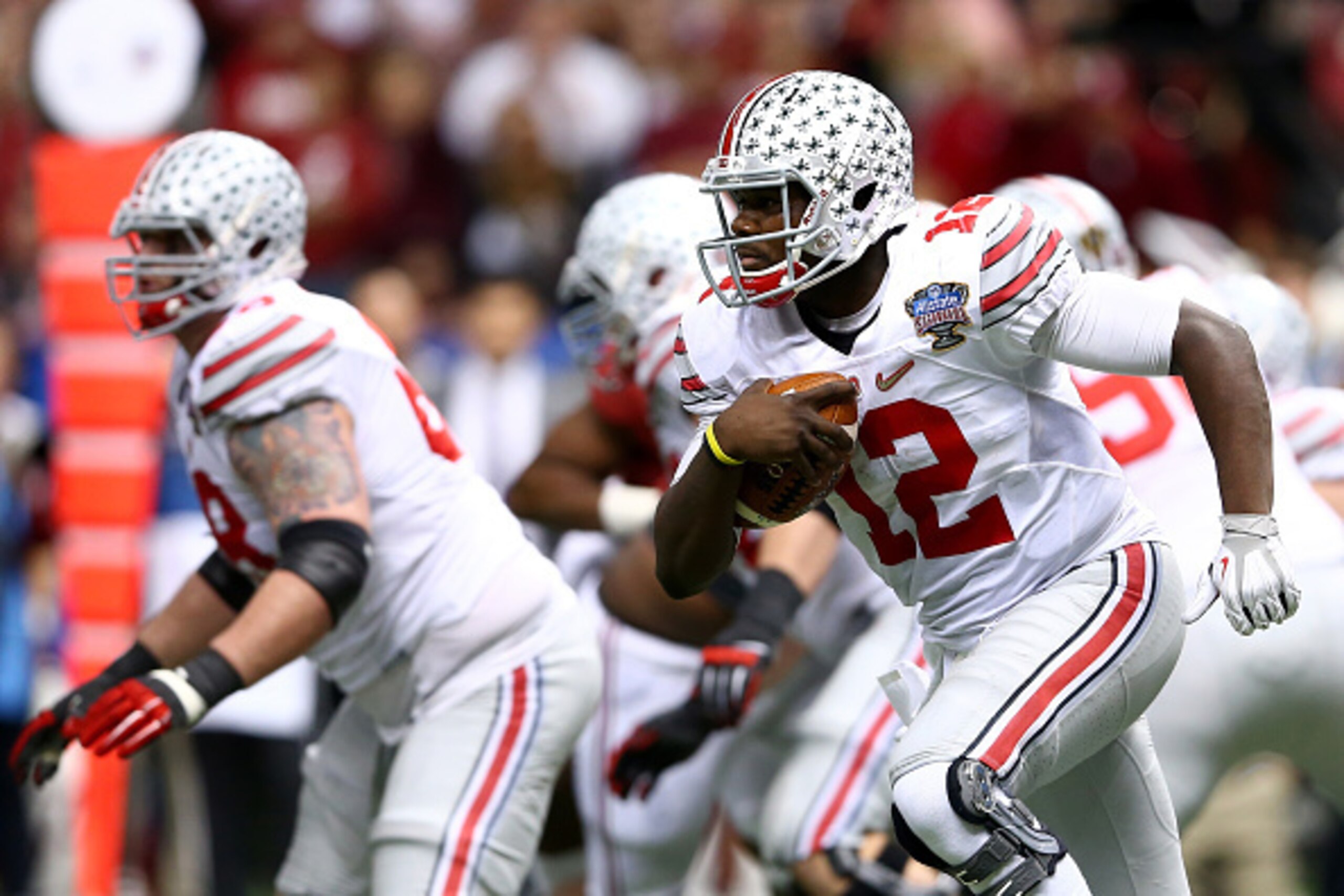 NEW ORLEANS, LA - JANUARY 01: Cardale Jones #12 of the Ohio State Buckeyes in action against the Alabama Crimson Tide during the All State Sugar Bowl at the Mercedes-Benz Superdome on January 1, 2015 in New Orleans, Louisiana. (Photo by Streeter Lecka/G NEW ORLEANS, LA - JANUARY 01: Cardale Jones #12 of the Ohio State Buckeyes in action against the Alabama Crimson Tide during the All State Sugar Bowl at the Mercedes-Benz Superdome on January 1, 2015 in New Orleans, Louisiana. (Photo by Streeter Lecka/G
