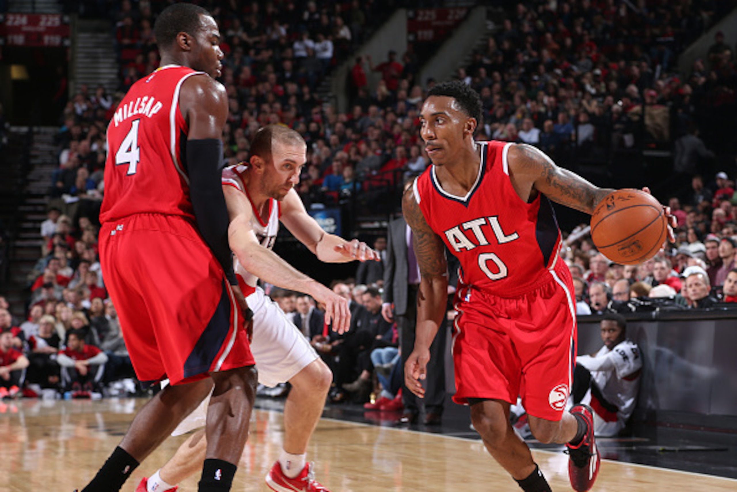 PORTLAND, OR - JANUARY 3:  Jeff Teague #0 of the Atlanta Hawks handles the ball against the Portland Trail Blazers on January 3, 2015 at the Moda Center Arena in Portland, Oregon. NOTE TO USER: User expressly acknowledges and agrees that, by downloading a