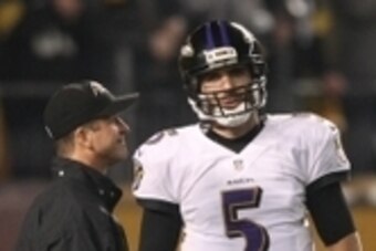 Jan 3, 2015; Pittsburgh, PA, USA; Baltimore Ravens head coach John Harbaugh (L) talks to Ravens quarterback Joe Flacco (5) prior to the 2014 AFC Wild Card playoff football game against the Pittsburgh Steelers at Heinz Field. Mandatory Credit: Jason Bridge
