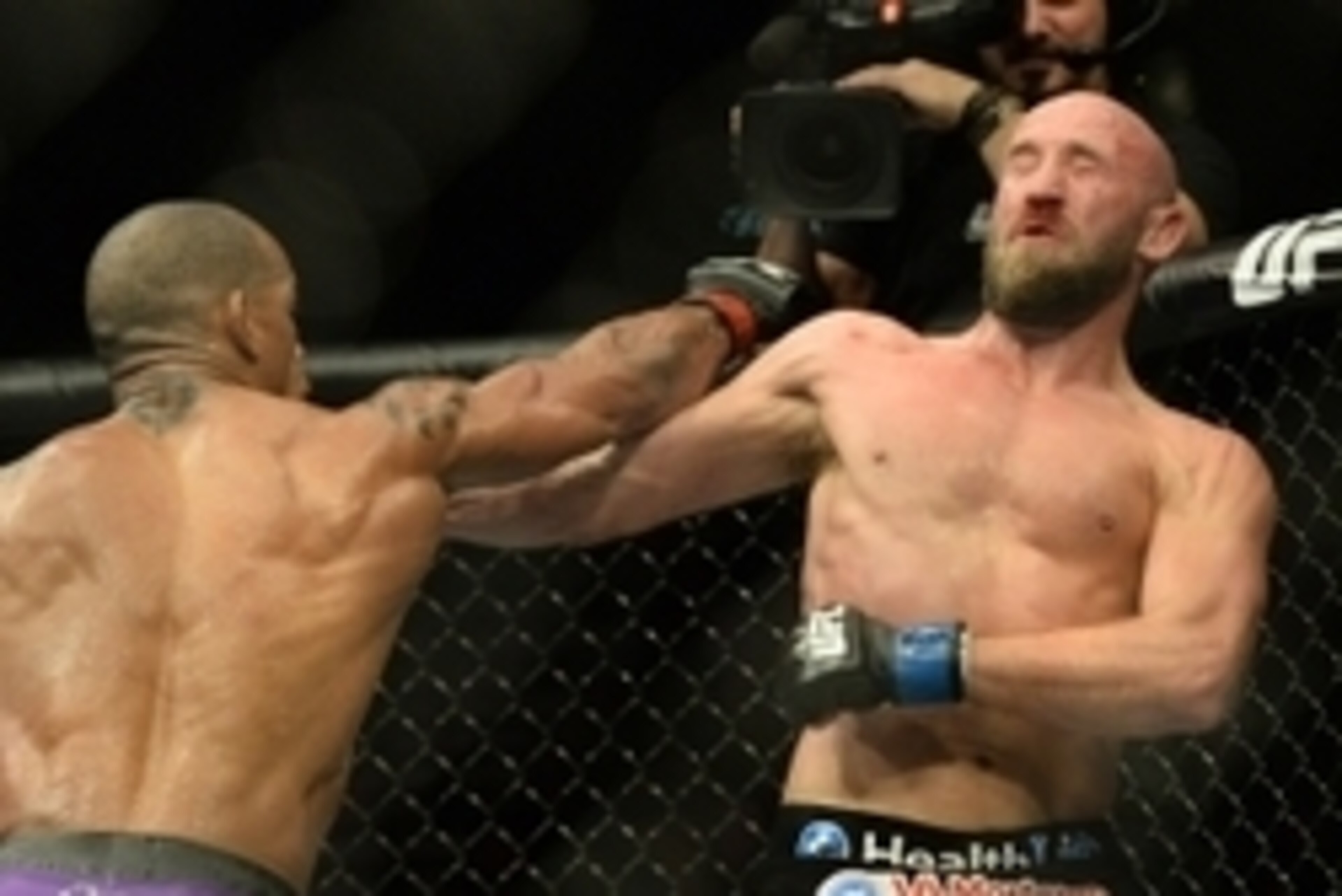 Jan 3, 2015; Las Vegas, NV, USA; Hector Lombard (red gloves) and Josh Burkman (blue gloves) compete in their welterweight bout at UFC 182 at MGM Grand Garden Arena. Lombard won. Mandatory Credit: Jayne Kamin-Oncea-USA TODAY Sports