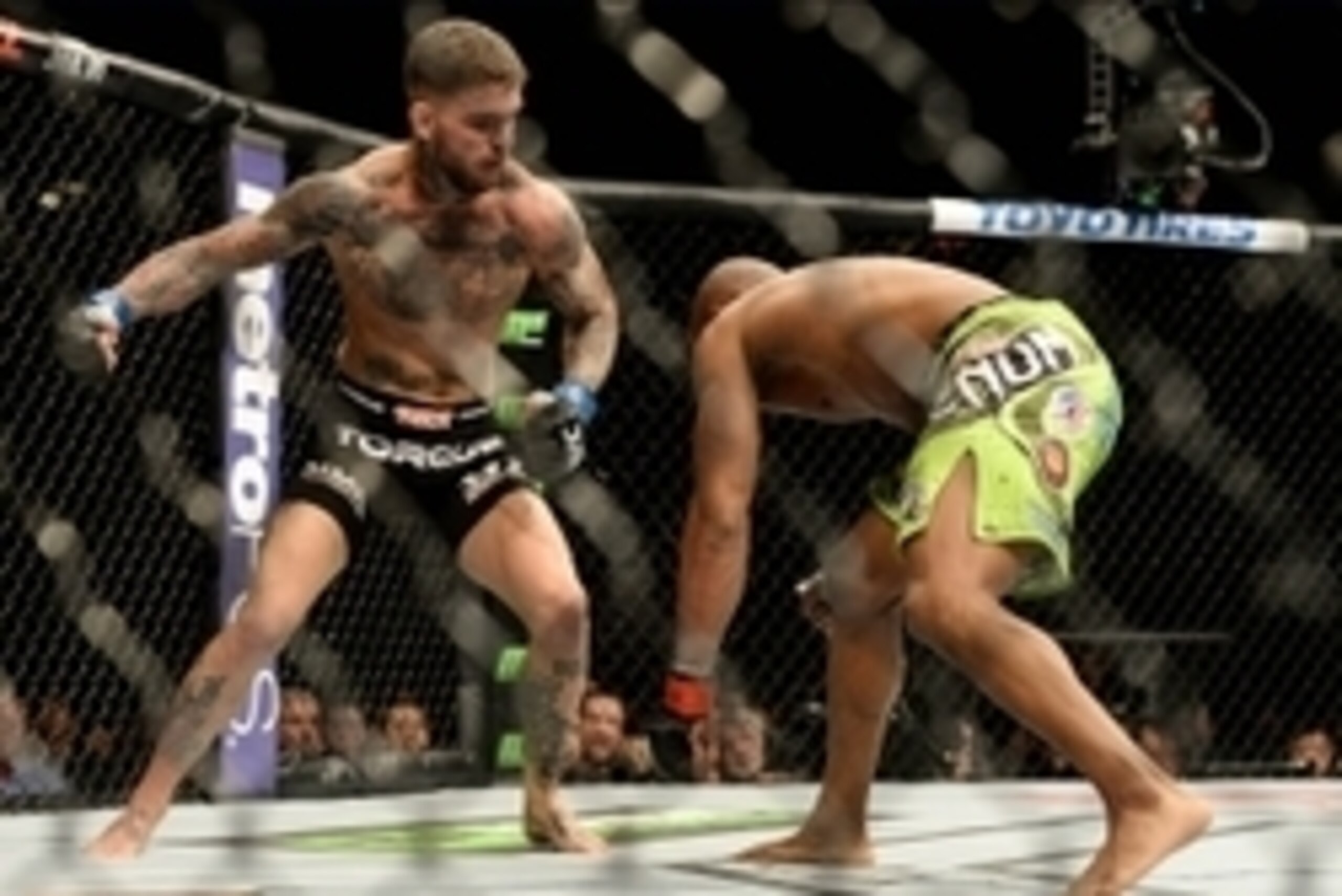 Jan 3, 2015; Las Vegas, NV, USA; Cody Garbrandt (blue gloves) and Marcus Brimage (red gloves) in their bantamweight bout at UFC 182 at the MGM Grand Garden Arena. Garbrandt won. Mandatory Credit: Jayne Kamin-Oncea-USA TODAY Sports