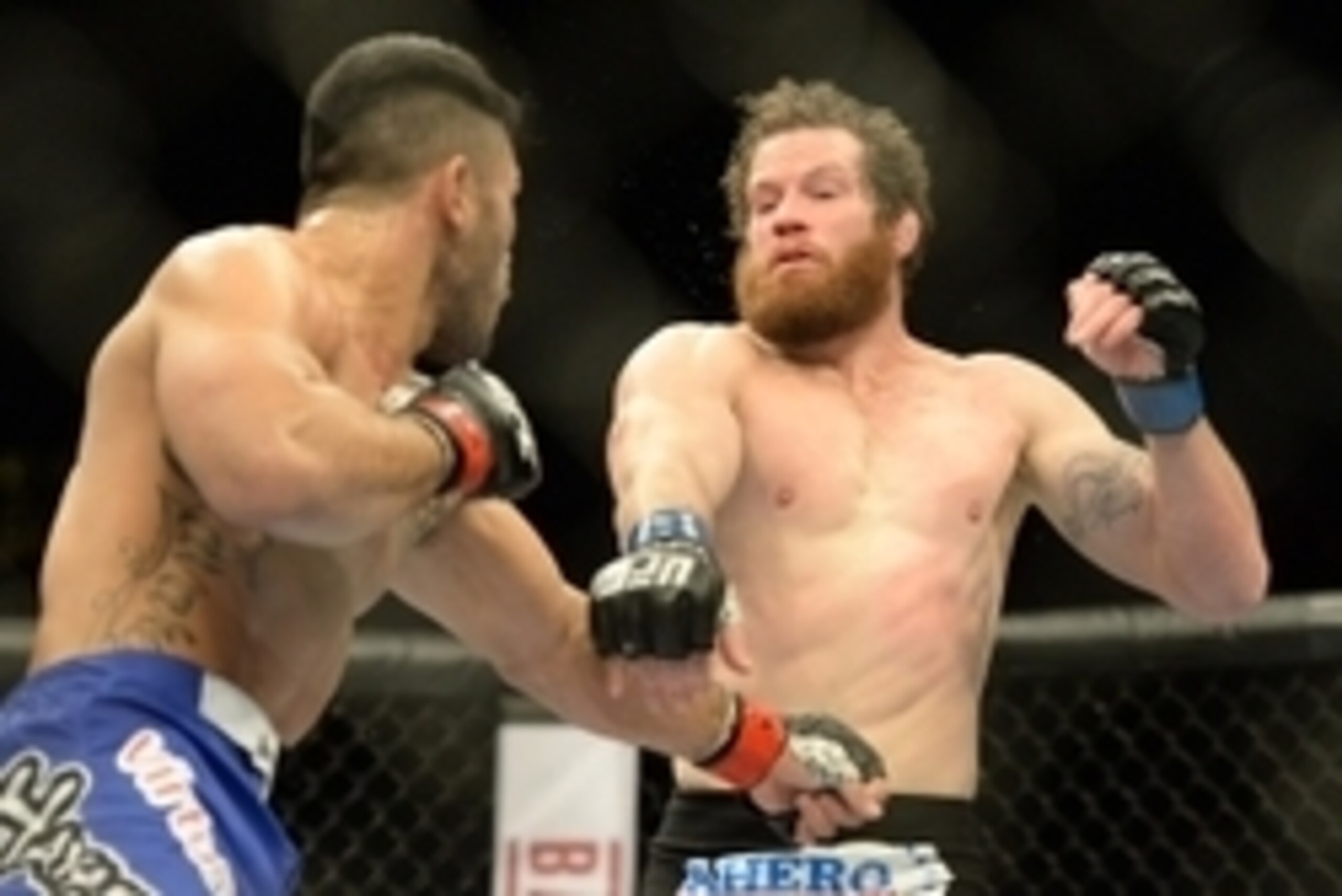 Jan 3, 2015; Las Vegas, NV, USA; Nate Marquardt (blue gloves) and Brad Tavares (red gloves) in their middleweight bout at UFC 182 at MGM Grand Garden Arena.Tavares won. Mandatory Credit: Jayne Kamin-Oncea-USA TODAY Sports