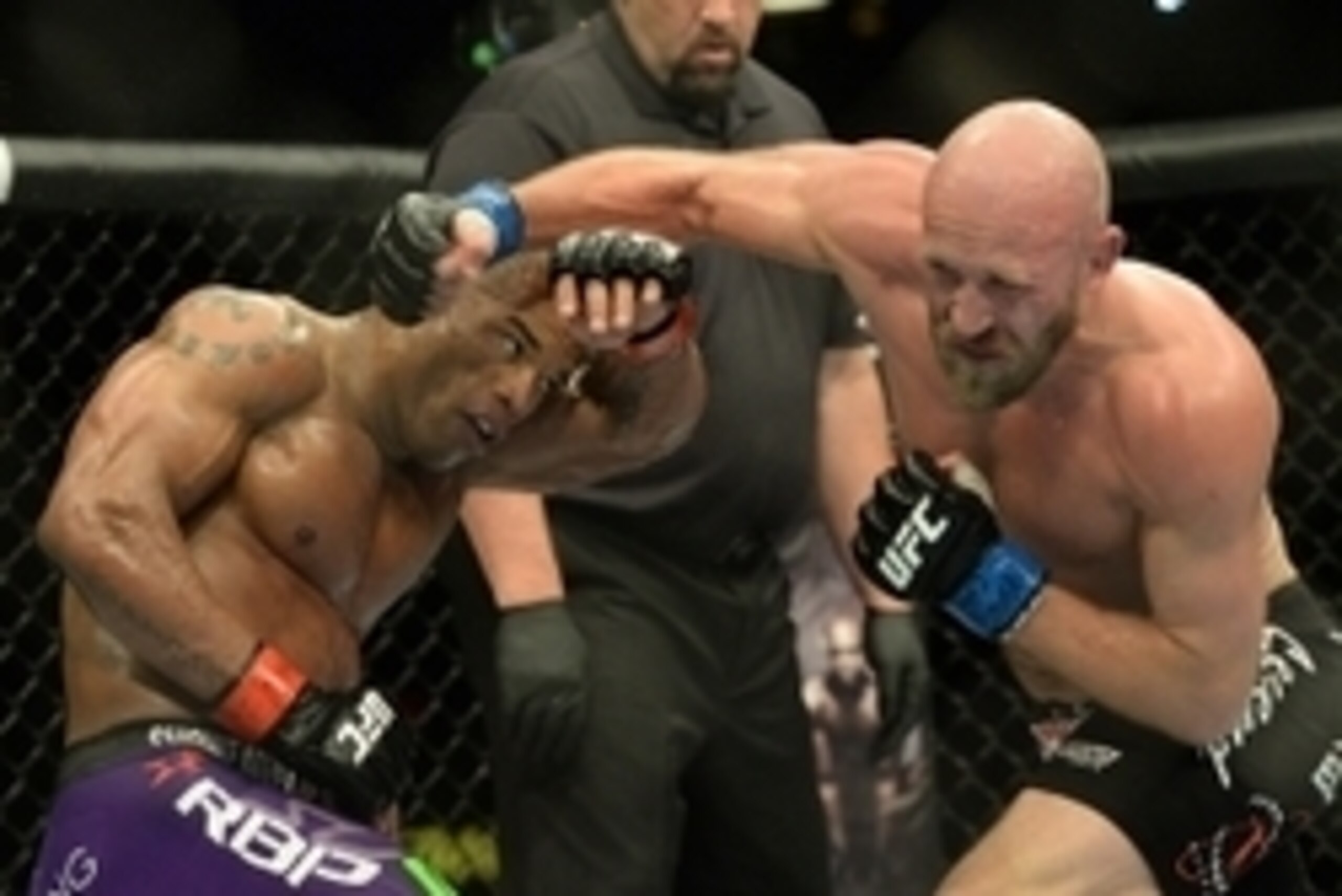 Jan 3, 2015; Las Vegas, NV, USA; Hector Lombard (red gloves) and Josh Burkman (blue gloves) compete in their welterweight bout at UFC 182 at MGM Grand Garden Arena. Lombard won. Mandatory Credit: Jayne Kamin-Oncea-USA TODAY Sports