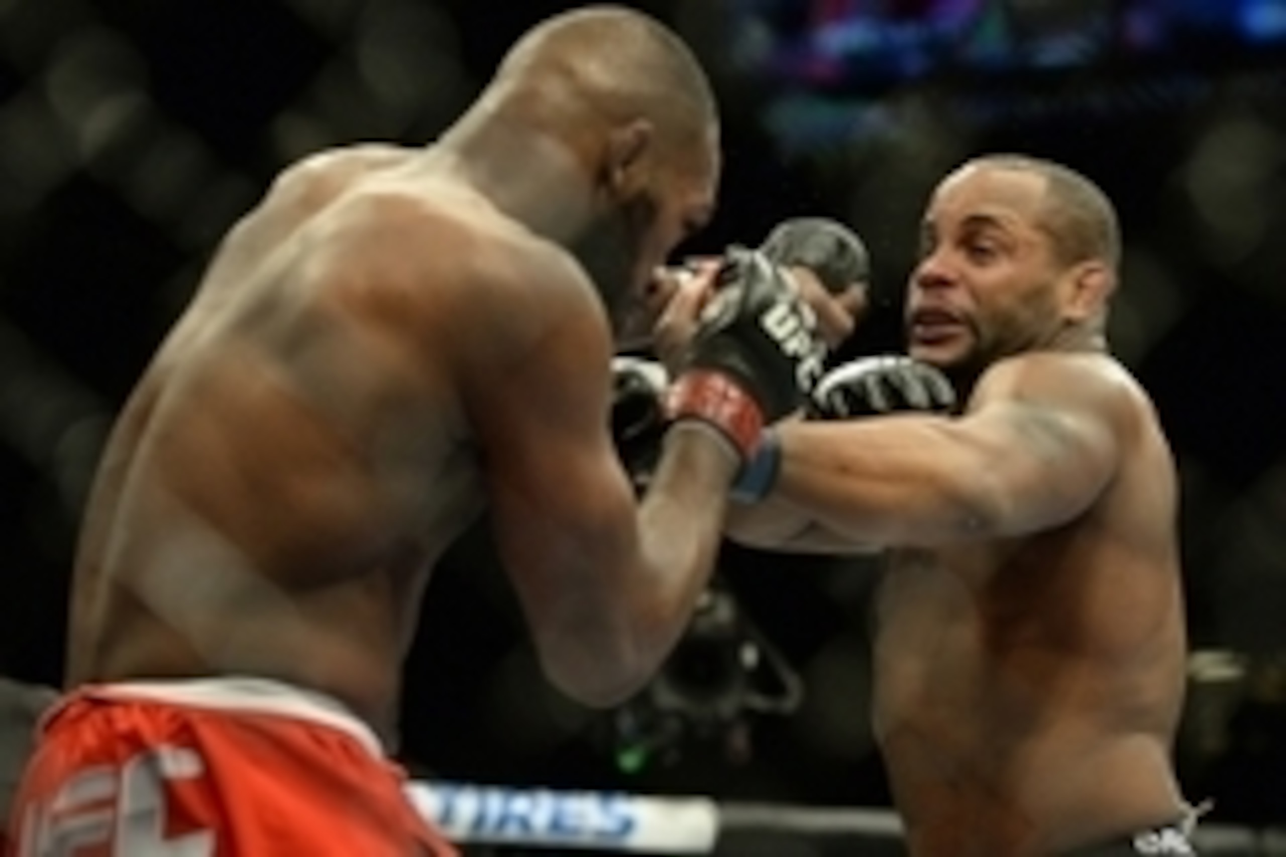 Jan 3, 2015; Las Vegas, NV, USA; Jon Jones (red gloves) and Daniel Cormier (blue gloves) compete in the light heavyweight title fight at UFC 182 at MGM Grand Garden Arena. Mandatory Credit: Jayne Kamin-Oncea-USA TODAY Sports