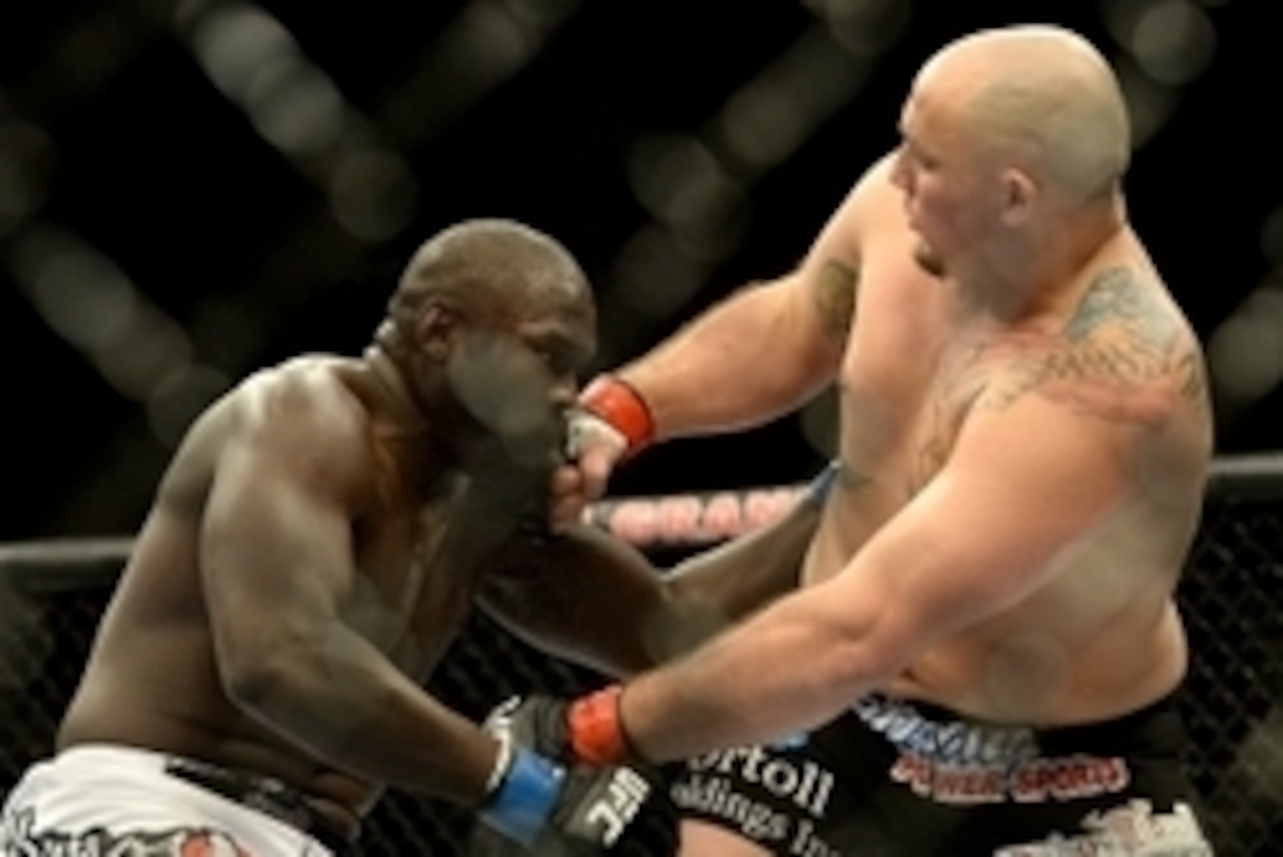 Jan 3, 2015; Las Vegas, NV, USA; Jared Cannonier (blue gloves) and Shawn Jordan (red gloves) compete in their heavyweight bout at UFC 182 at MGM Grand Garden Arena. Jordan won in a first round TKO. Mandatory Credit: Jayne Kamin-Oncea-USA TODAY Sports