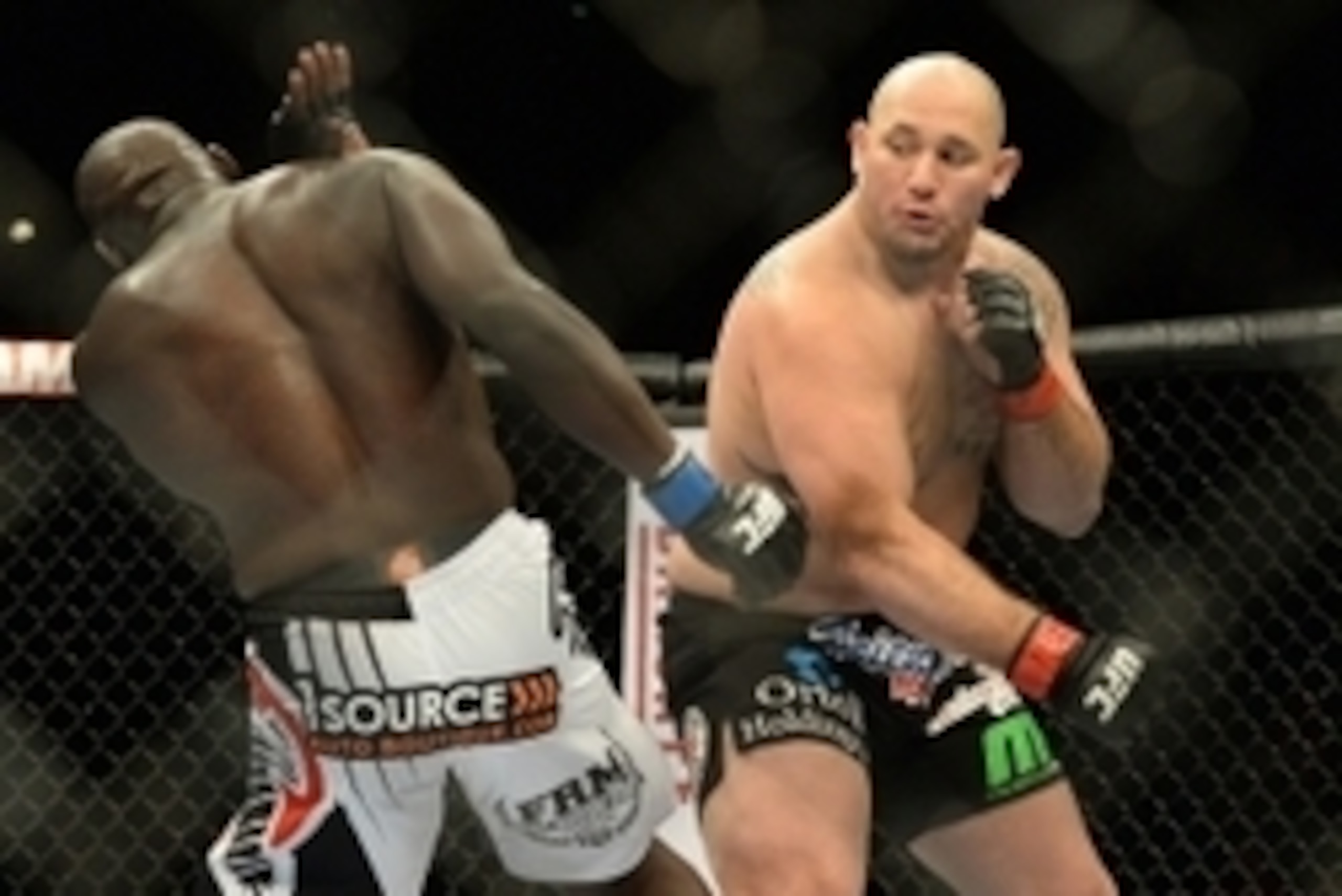 Jan 3, 2015; Las Vegas, NV, USA; Jared Cannonier (blue gloves) and Shawn Jordan (red gloves) compete in their heavyweight bout at UFC 182 at MGM Grand Garden Arena. Jordan won in a first round TKO. Mandatory Credit: Jayne Kamin-Oncea-USA TODAY Sports