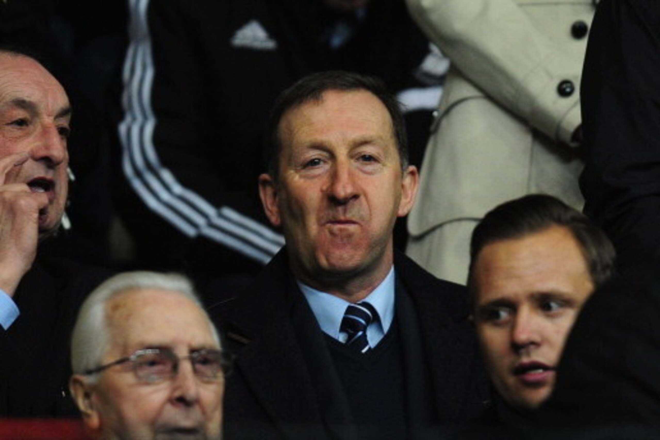 SWANSEA, WALES - FEBRUARY 20:  Swansea chairman Huw Jenkins (c) looks on before the UEFA Europa League Round of 32 first leg between Swansea City and SSC Napoli at Liberty Stadium on February 20, 2014 in Swansea, Wales.  (Photo by Stu Forster/Getty Images