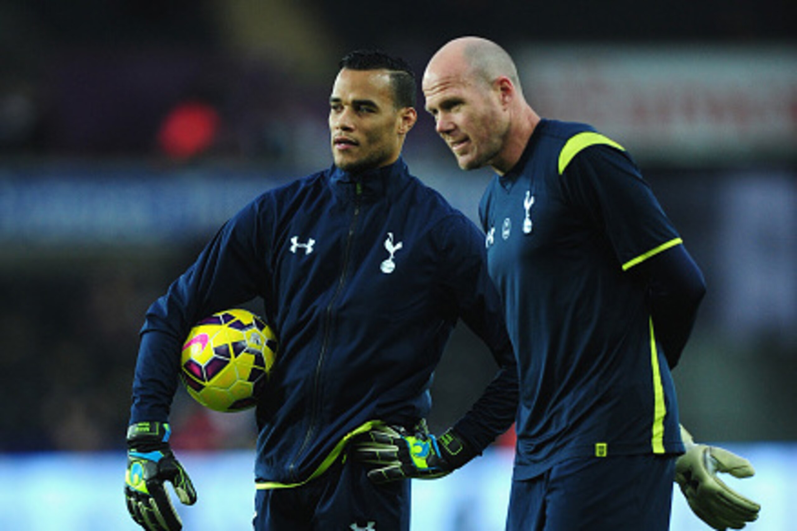 SWANSEA, WALES - DECEMBER 14:  Spurs goalkeepers Brad Friedel (r) and former Swansea player Michel Vorm look on before the Barclays Premier League match between Swansea City and Tottenham Hotspur at Liberty Stadium on December 14, 2014 in Swansea, Wales. 