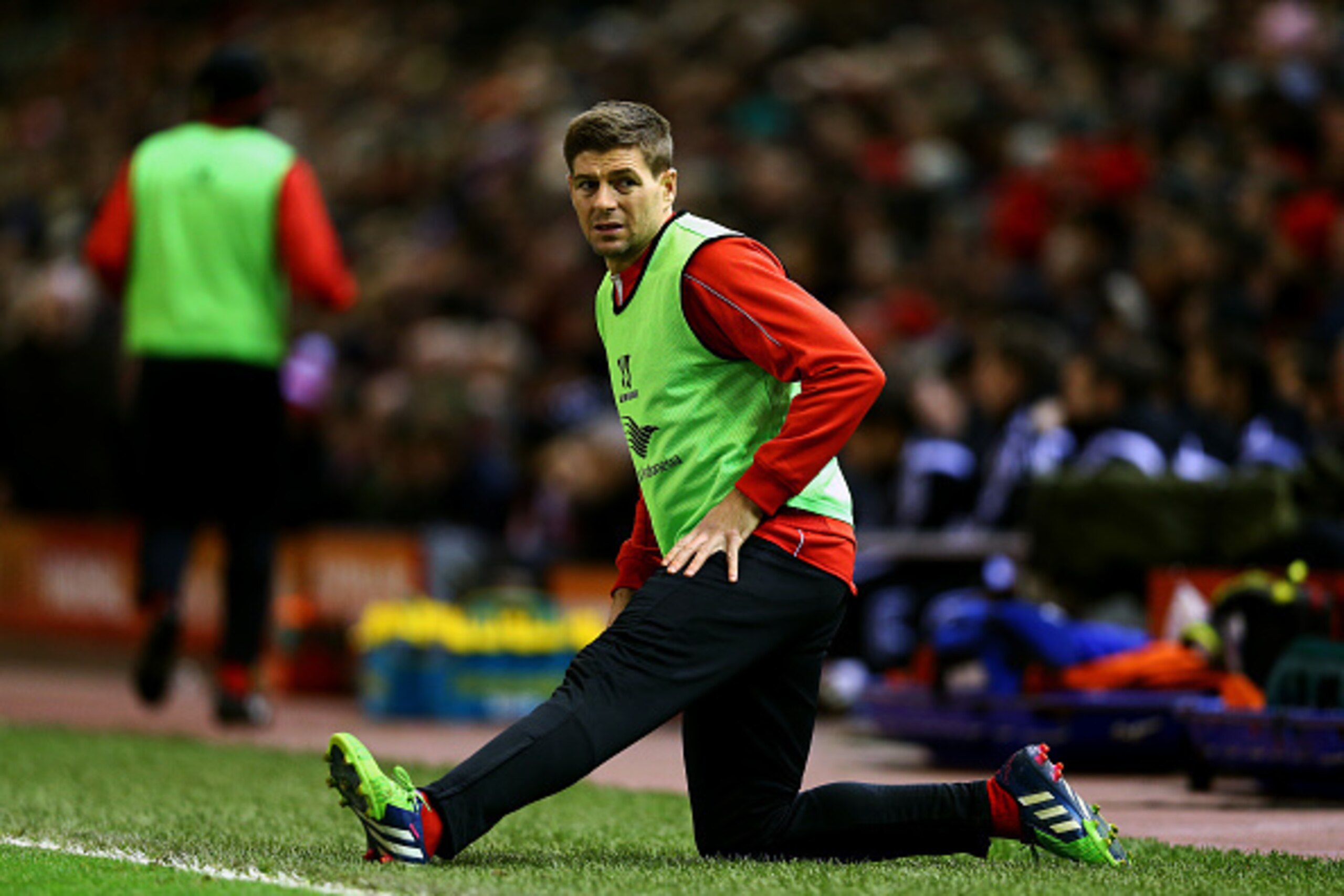 LIVERPOOL, ENGLAND - DECEMBER 29:  Steven Gerrard of Liverpool warms up on the touchline during the Barclays Premier League match between Liverpool and Swansea City at Anfield on December 29, 2014 in Liverpool, England.  (Photo by Clive Brunskill/Getty Im