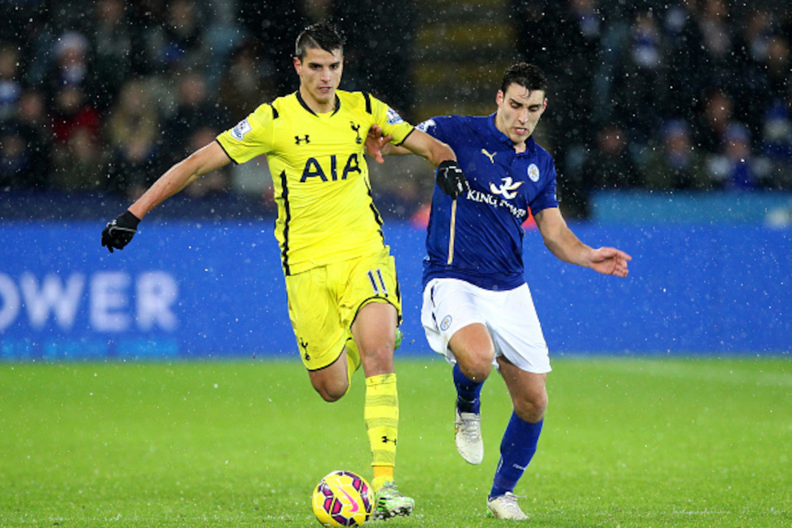 LEICESTER, ENGLAND - DECEMBER 26:  Erik Lamela of Spurs battles for the ball with Matthew James of Leicester City during the Barclays Premier League match between Leicester City and Tottenham Hotspur at The King Power Stadium on December 26, 2014 in Leice